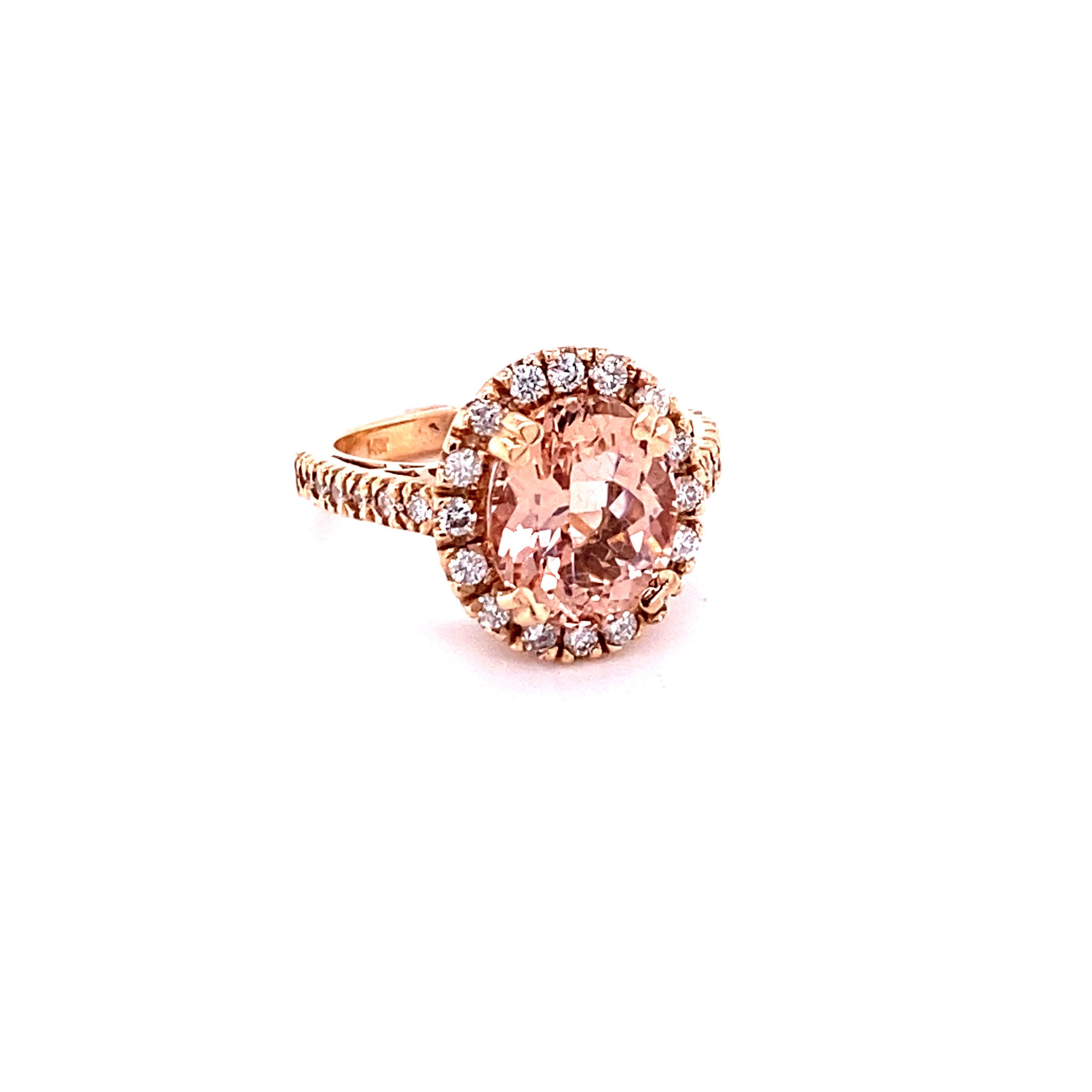 This Morganite ring has a beautiful 3.84 Carat Oval Cut Morganite and is surrounded by a simple halo of  28 Round Cut Diamonds that weigh 0.57 Carats.  The diamonds have a clarity and color of SI-F. The total carat weight of the ring is 4.41 Carats.