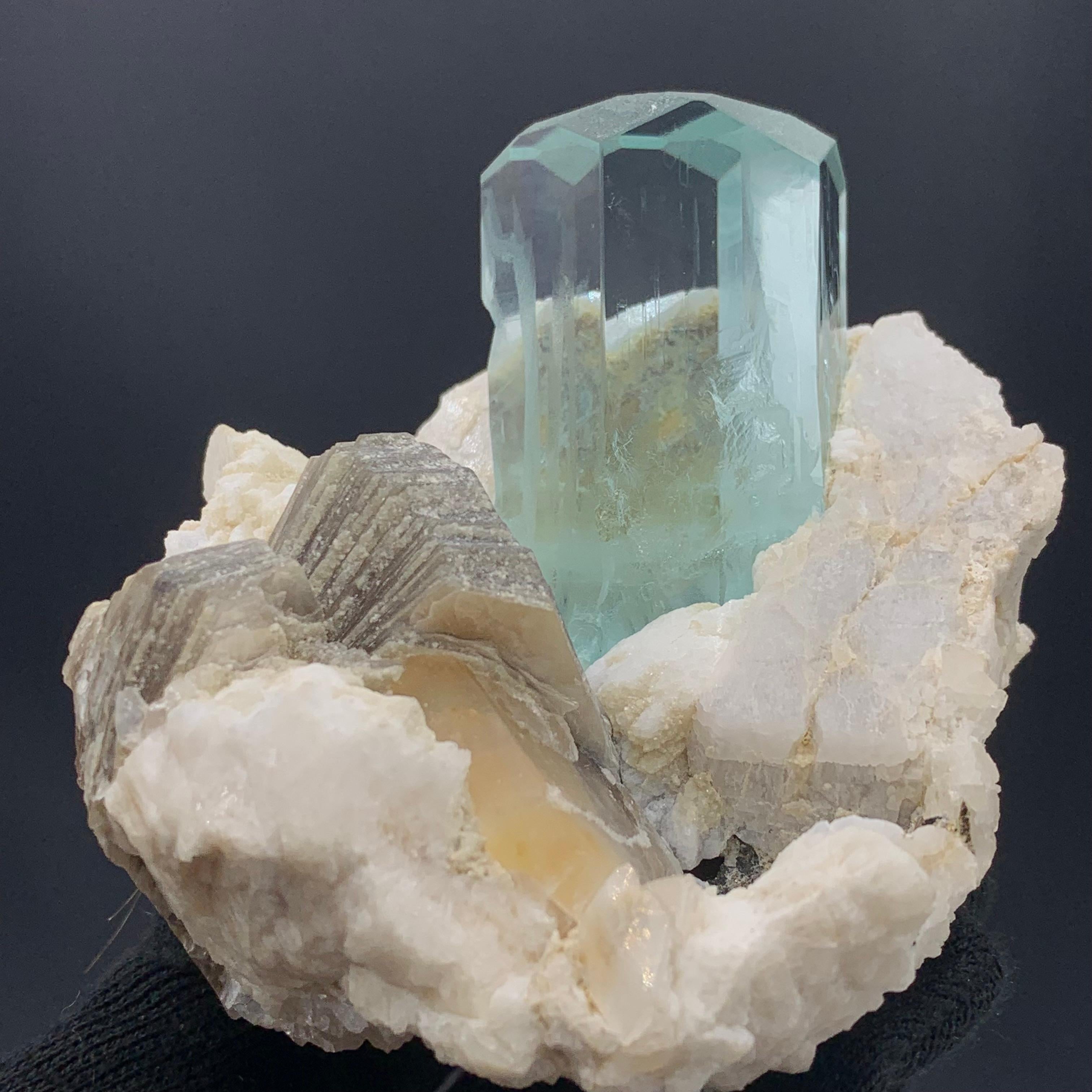 Exquisite Aquamarine Specimen With Mica And Feldspar From Pakistan 
Weight: 441 Gram 
Dimension: 8 x 8.5 x 7.5 Cm
Origin: Skardu Valley, Pakistan 

Aquamarine helps us to gain insight, truth, and wisdom. It can be used to help calm the mind, nerves,
