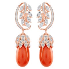 Boucles d'oreilles pendantes en forme de feuille, avec un corail de 44,16 carats et un diamant SI/H de 7,2 carats, en or rose 18 carats