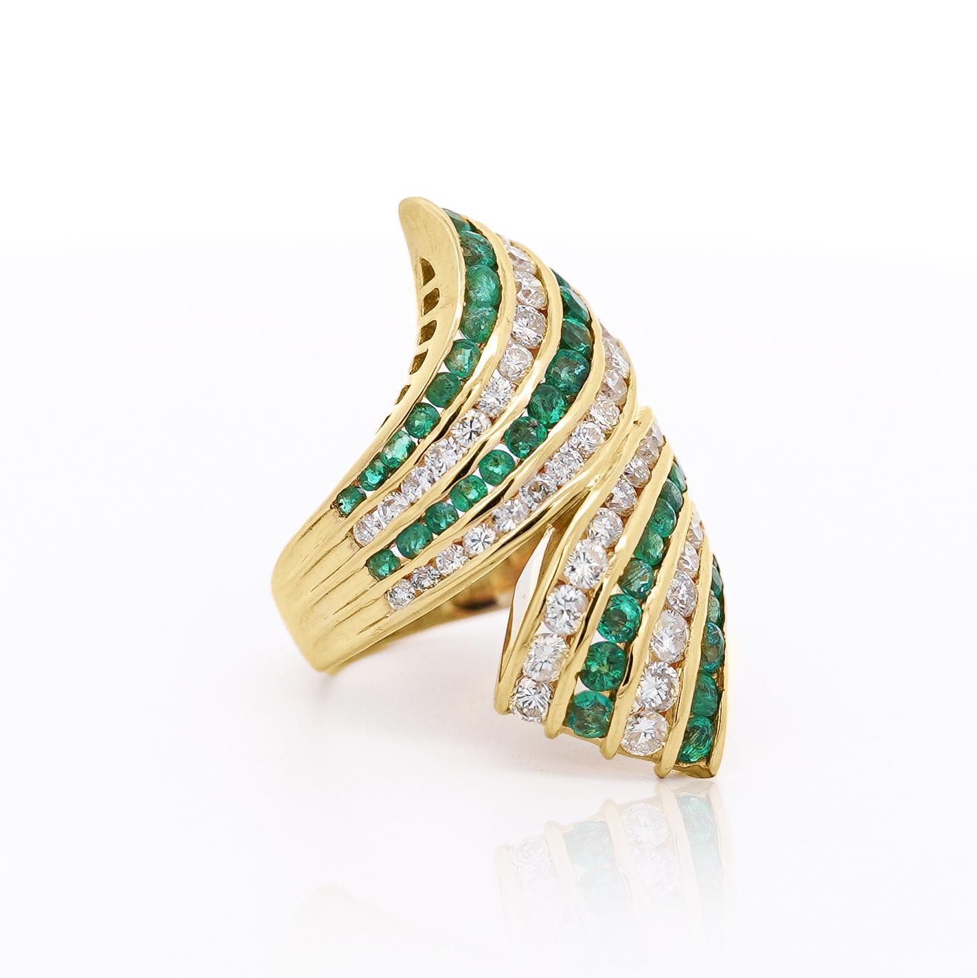 A bold and elegant bypass ring featuring 2.15 carats of emeralds and 2.27 carats of diamonds, set in 18K yellow gold for a striking, dynamic design.

Details:
Item Type: Bypass Ring
Metal: 18K Yellow Gold 
Size: 6 1/2
Weight: 14.13 Grams
Ring Face