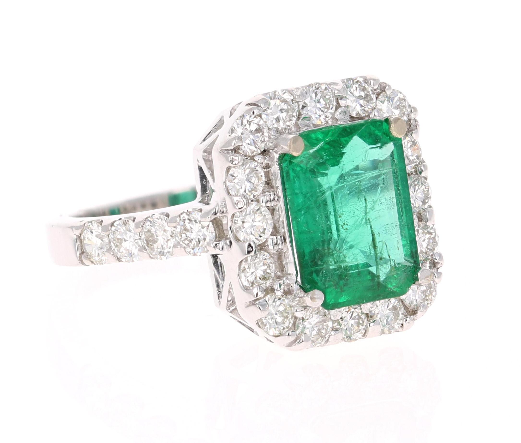 A beautiful modern classic setting holding a magnificent natural Emerald that weighs 2.94 carats.  This gorgeous ring also has 24 Round Cut Diamonds that weigh 1.48 carats.  The Clarity is a VS2 and the Color is a H.  The total carat weight of the