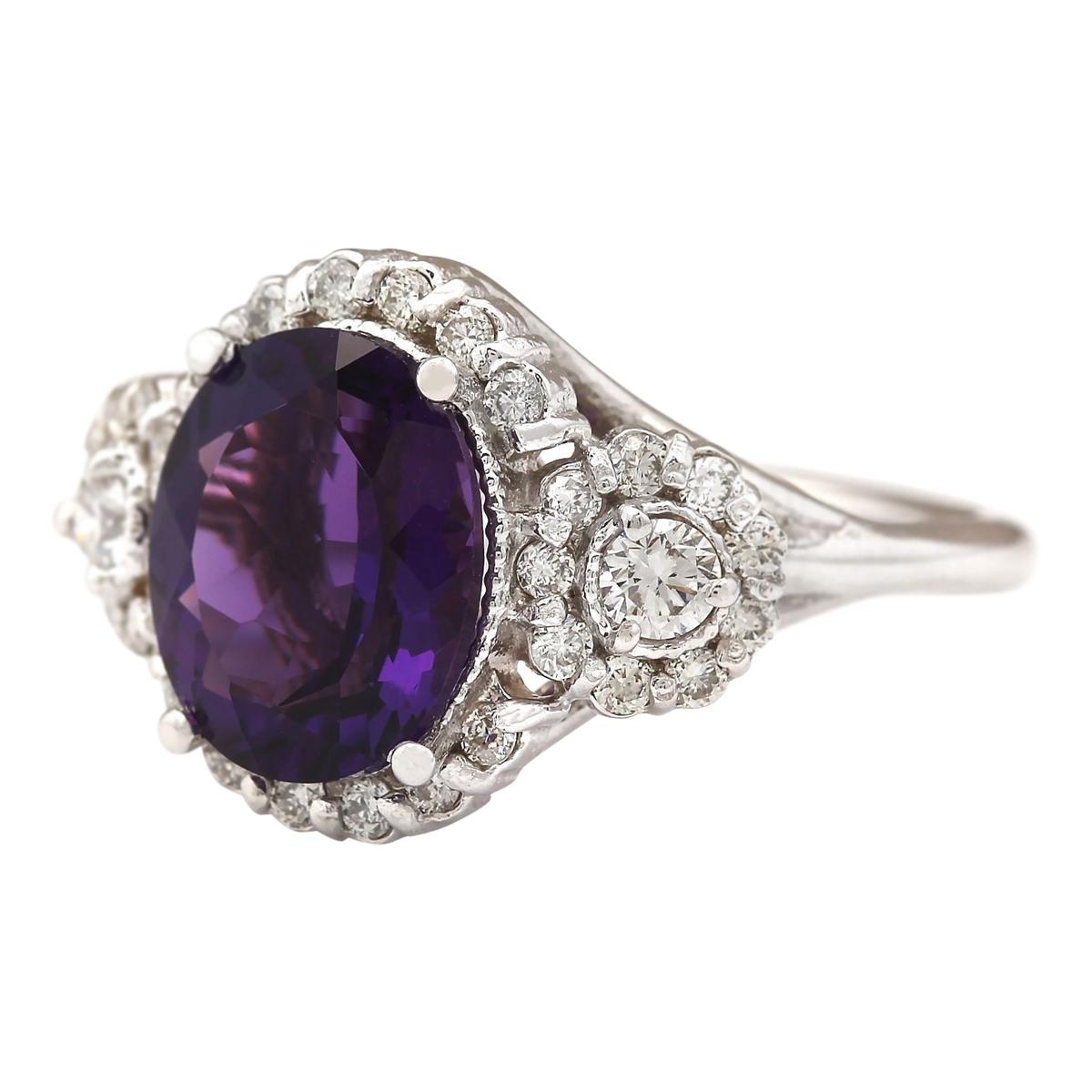 4.42 Carat Natural Amethyst 14 Karat White Gold Diamond Ring
Stamped: 14K White Gold
Total Ring Weight: 5.9 Grams
Total Natural Amethyst Weight is 3.17 Carat (Measures: 11.00x9.00 mm)
Color: Purple
Total Natural Diamond Weight is 1.25 Carat
Color: