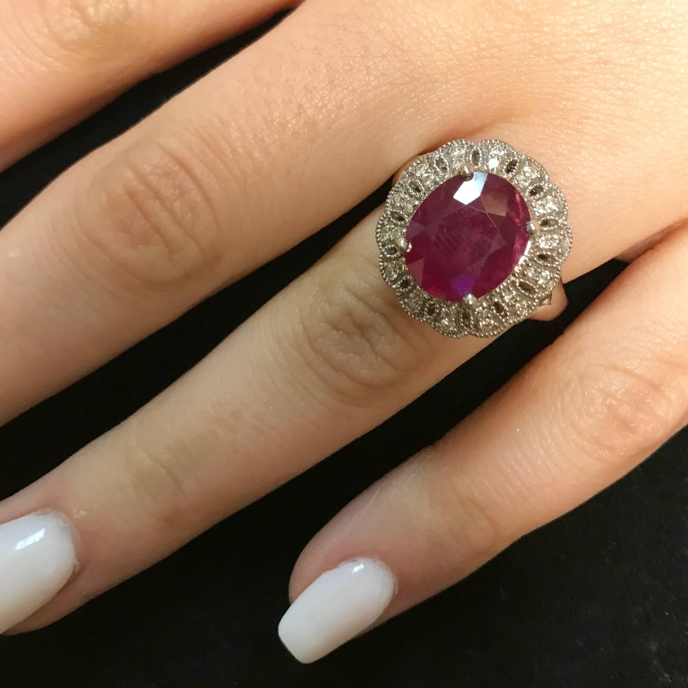 Oval Cut 4.42 Carat Oval Ruby and 0.34 Carat White Diamond Ring