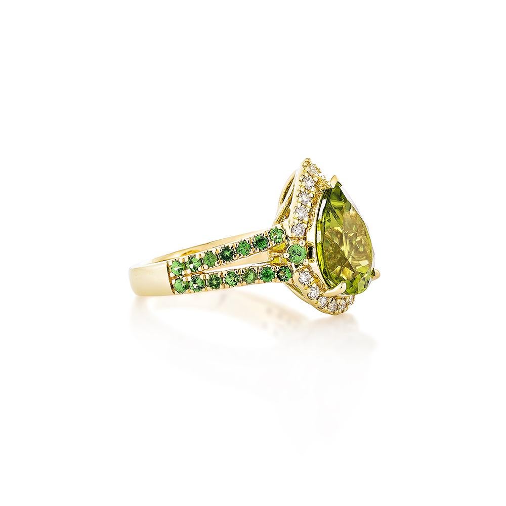 This collection features a selection of the most Olivia hue peridot gemstone. Uniquely designed this ring with tsavorite and diamonds in yellow gold to present a rich and regal look.

Peridot Fancy Ring in 18Karat Yellow Gold with Tsavorite and