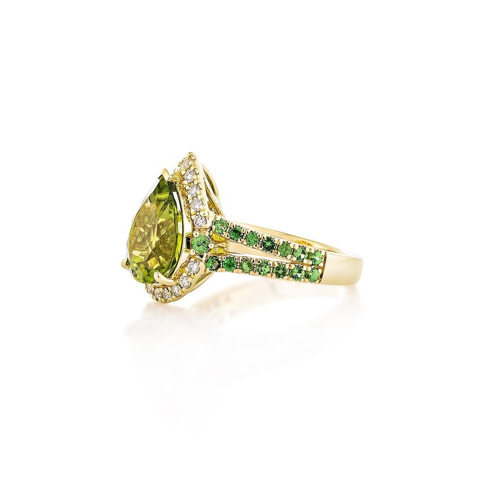 Pear Cut 4.42 Carat Peridot Fancy Ring in 18KYG with Tsavorite and White Diamond.   For Sale