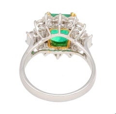 4.42 Carat TW Colombian Emerald with Round & Emerald Cut Diamond Halo 18K Ring