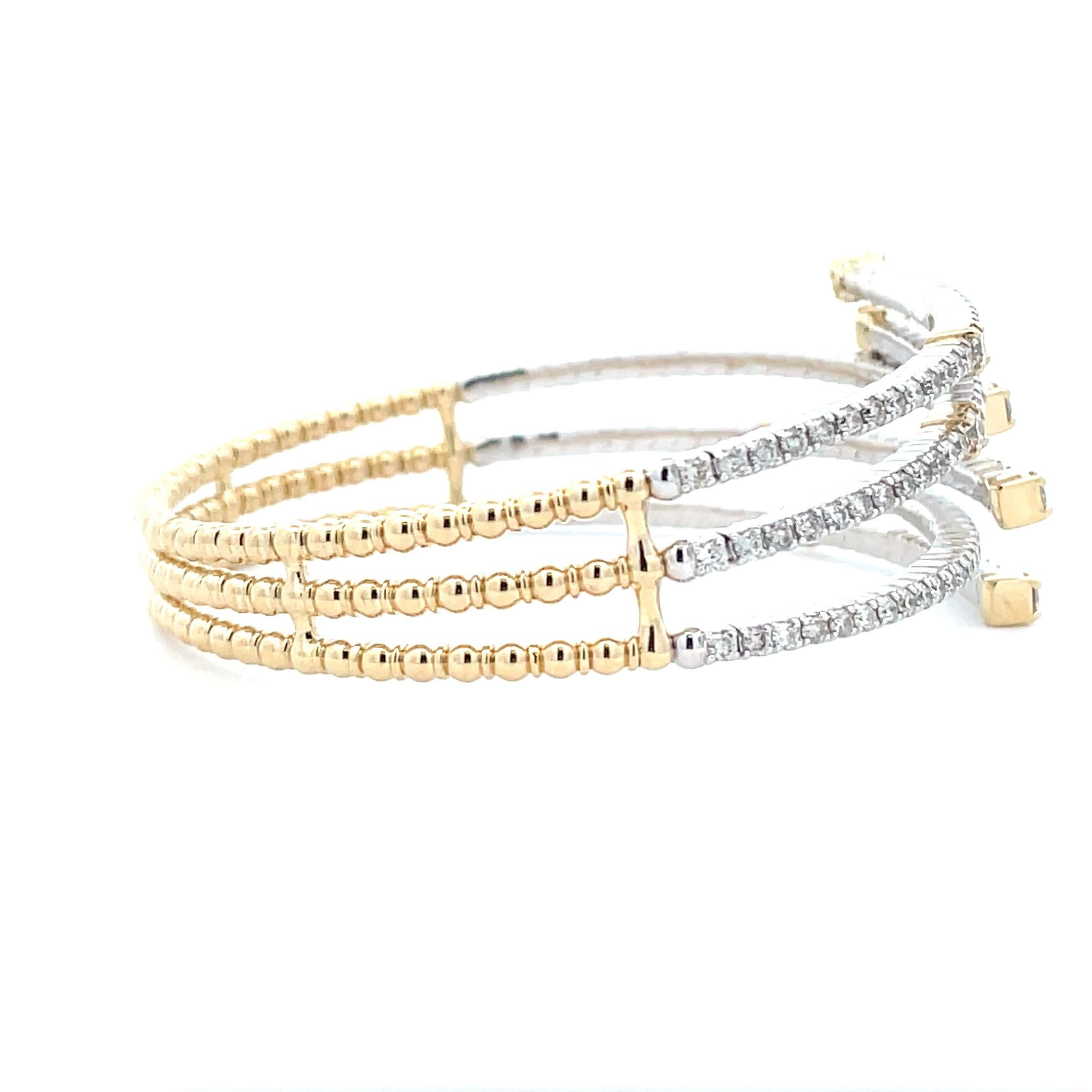 Designed and handcrafted by a professional artisan, our Beaded Diamond Bangle is crafted from 14K Yellow Gold and White Gold, creating a beautiful two-tone effect. The sophisticated multi- strand design makes this the ultimate statement piece in any