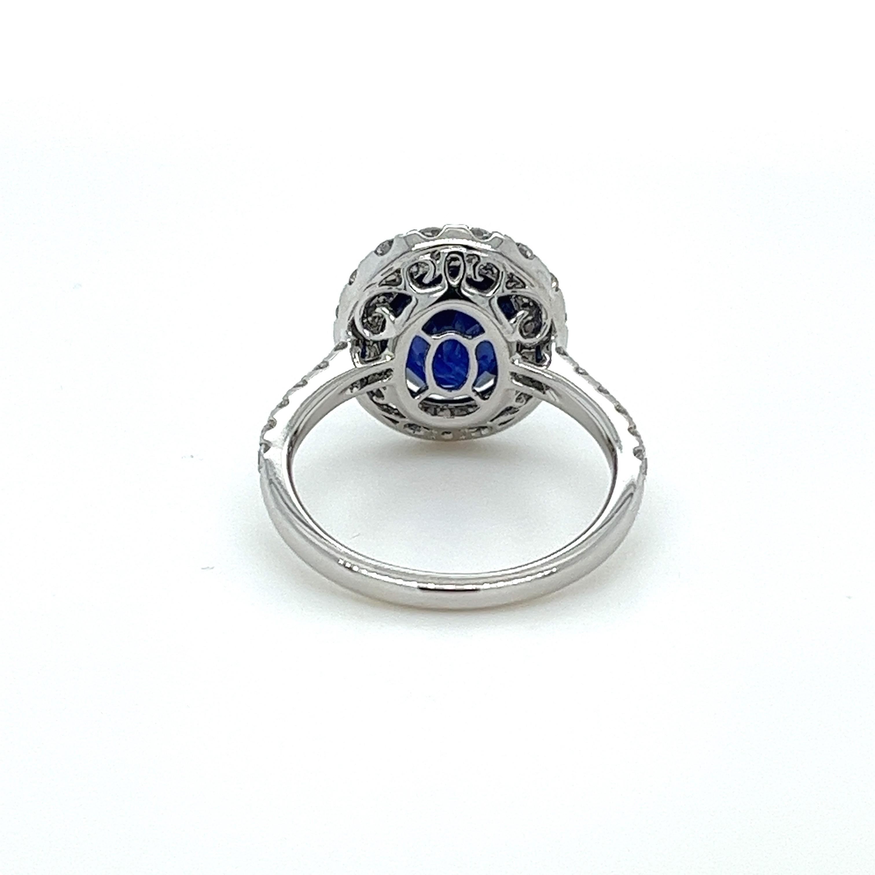 Oval Cut 4.43 Carat Oval Ceylon sapphire & Diamond Halo Ring in 18 Karat White Gold For Sale