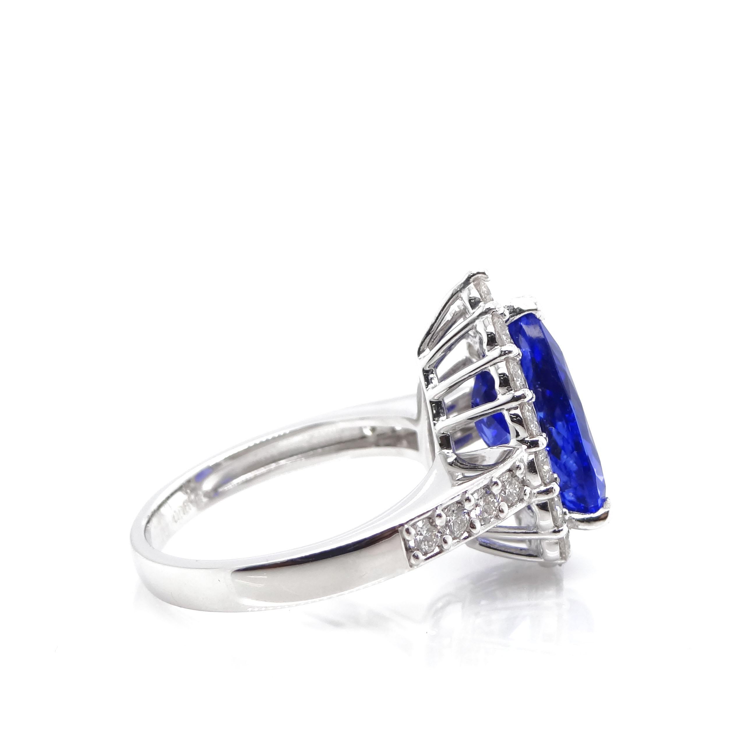 This is a stunning engagement ring consisting of a Pear-Shaped 4.43 Carat Tanzanite and 0.89 Carats of Diamond Accents set in Platinum. The Tanzanite exhibits a beautiful Violetish-Purple to Blue Hue. Tanzaniteis named after Tanzania which is the