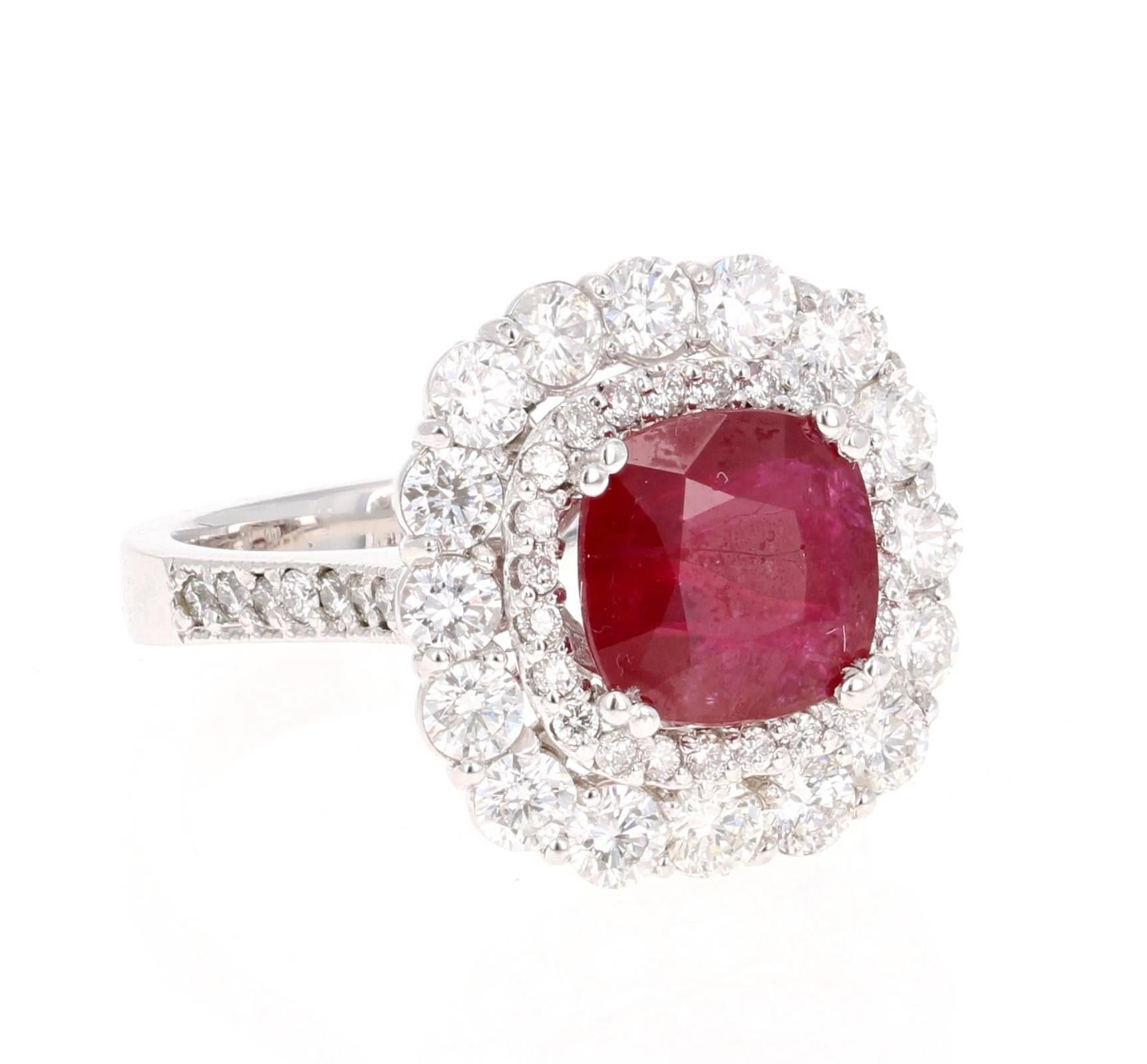 This is a breath-taking Ruby and Diamond ring.  The Ruby has origins from Southern Africa (Republic of Mozambique) and is 2.58 carats. It has a double halo of 54 Round Cut Diamonds weighing 1.85 carats (Clarity: SI2, Color: F). The total carat