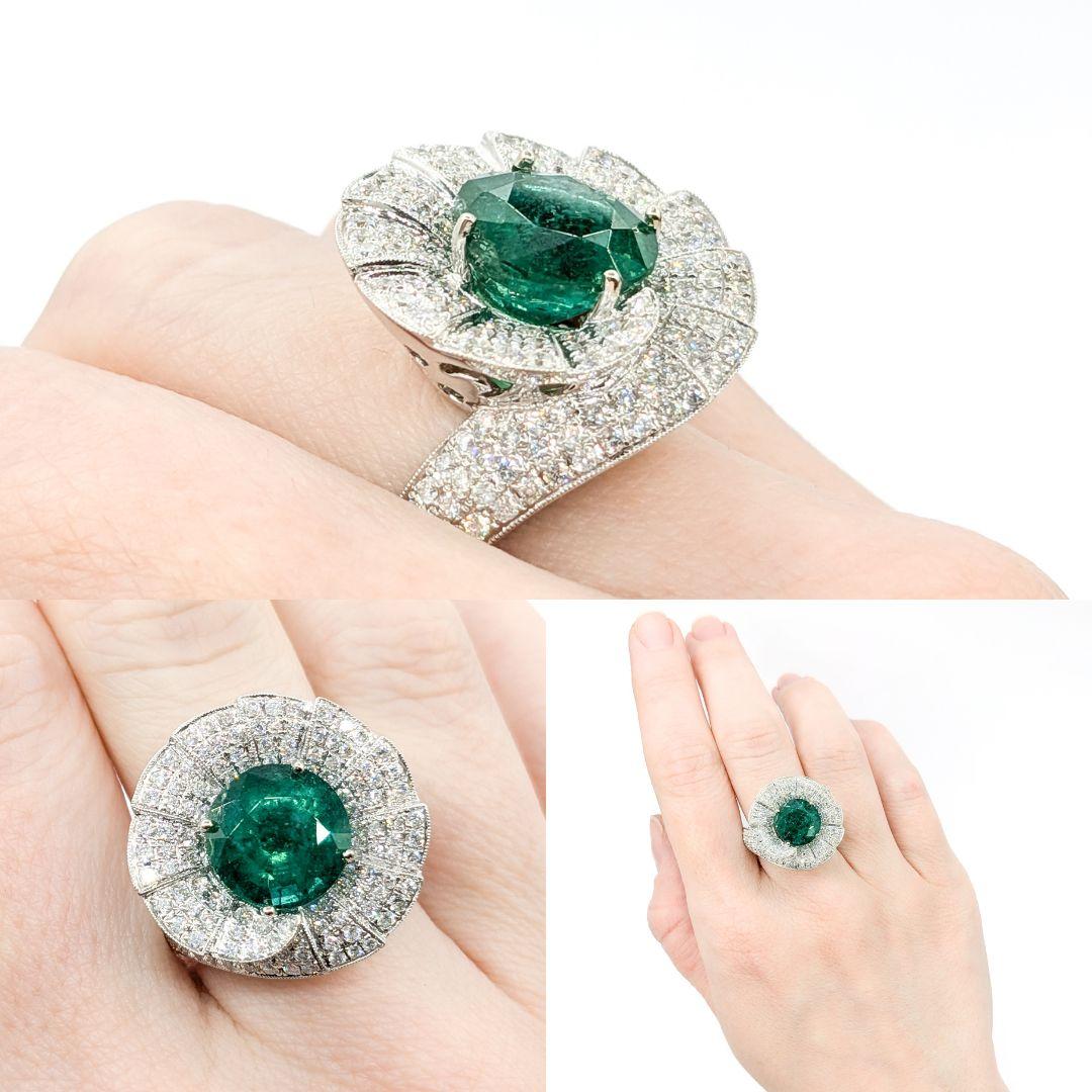 4.43ct Emerald Ring With Diamonds In 18kt White Gold

Introducing this magnificent Fan Swirl gemstone ring, meticulously crafted in 18kt white gold. This stunning piece features a prominent 4.43ct emerald centerpiece, the birthstone of May, known