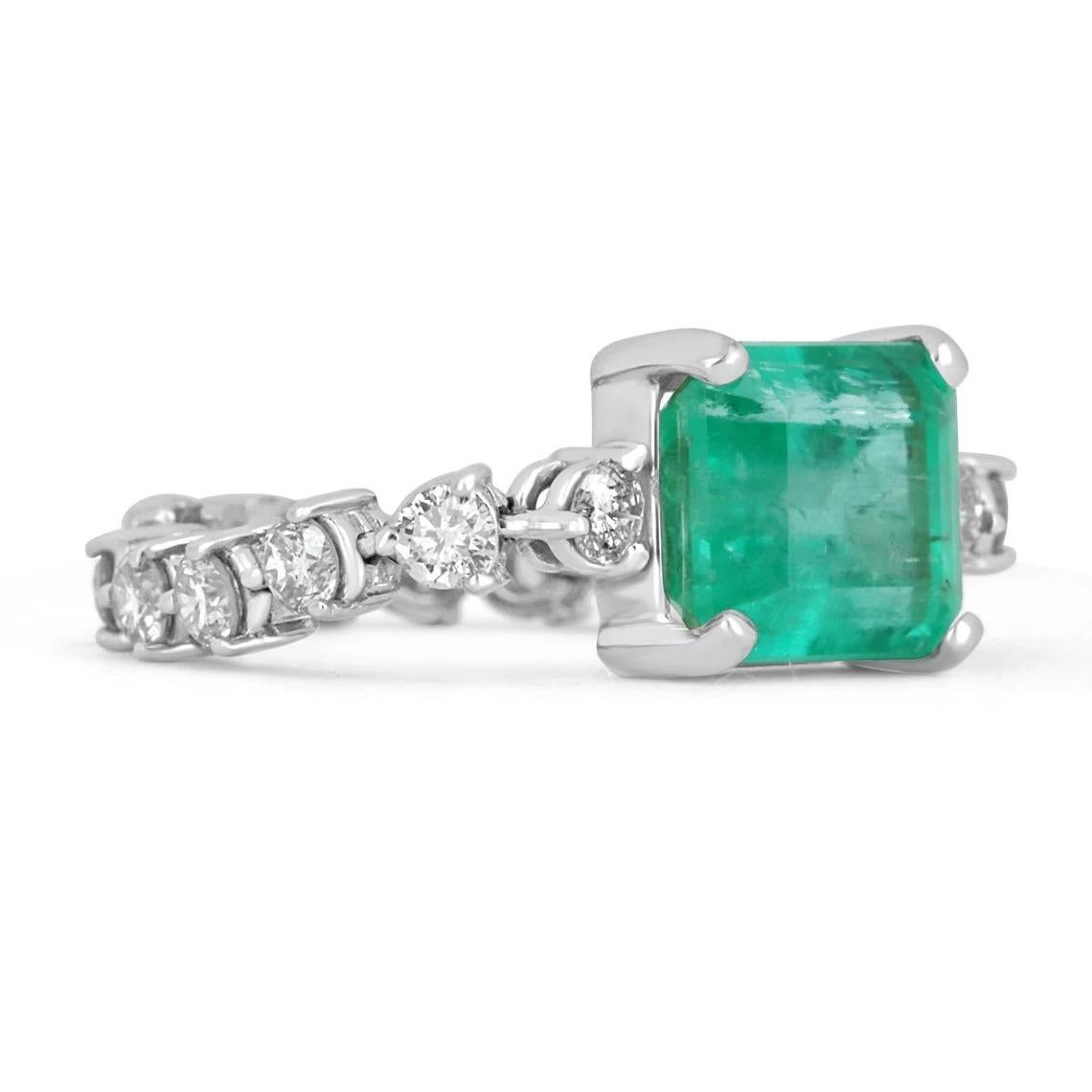 Elegantly displayed is a natural, emerald-cut Colombian emerald and diamond accent ring. The center gem is a beautiful quality, emerald cut, emerald filled with life and brilliance! Among the emeralds, impressive qualities are their vibrant color