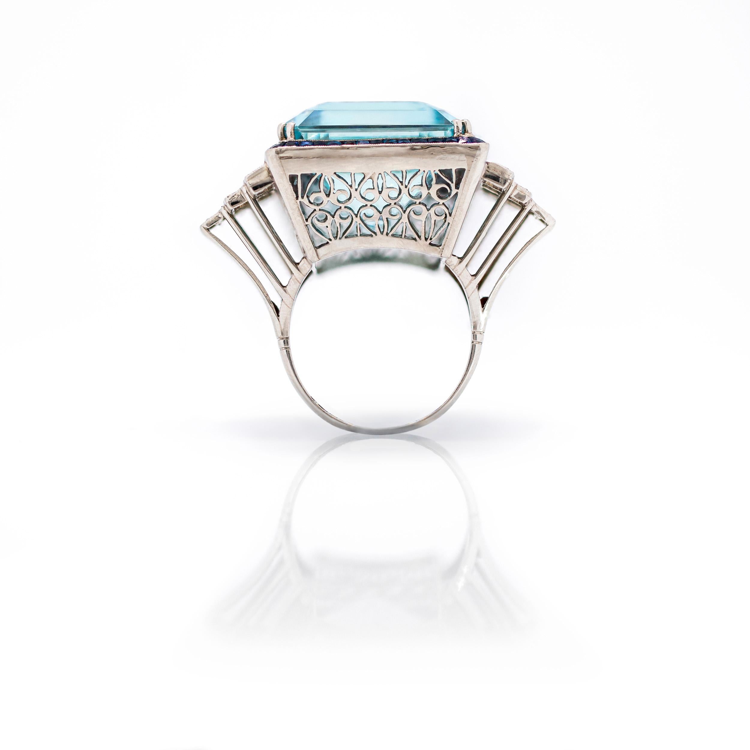 Impressive Emerald Cut Aquamarine surrounded by French Cut Sapphires and Diamond Ring

Eleanor is named for Former First Lady Eleanor Rosevelt, who received a stunning 1,298 Carat Aquamarine from President Vargas of Brazil in 1936. What a gift!