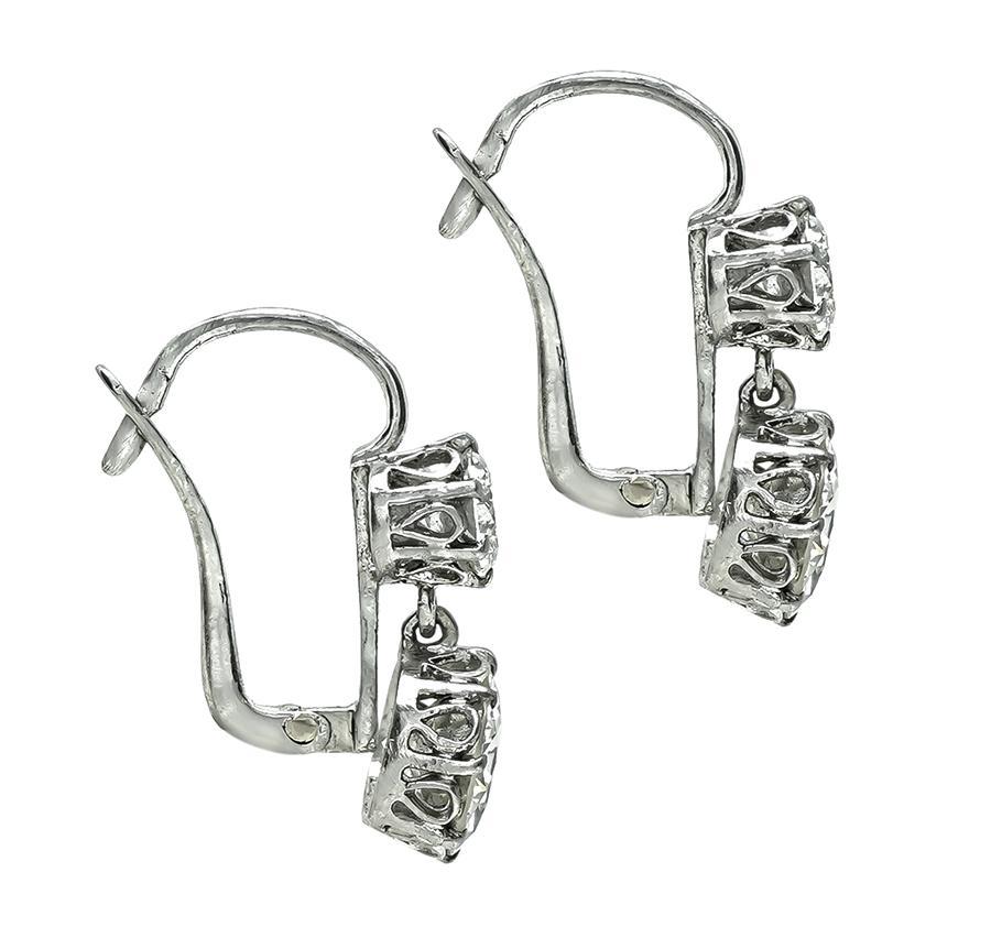 Round Cut 4.44cttw Diamond Dangling Earrings For Sale