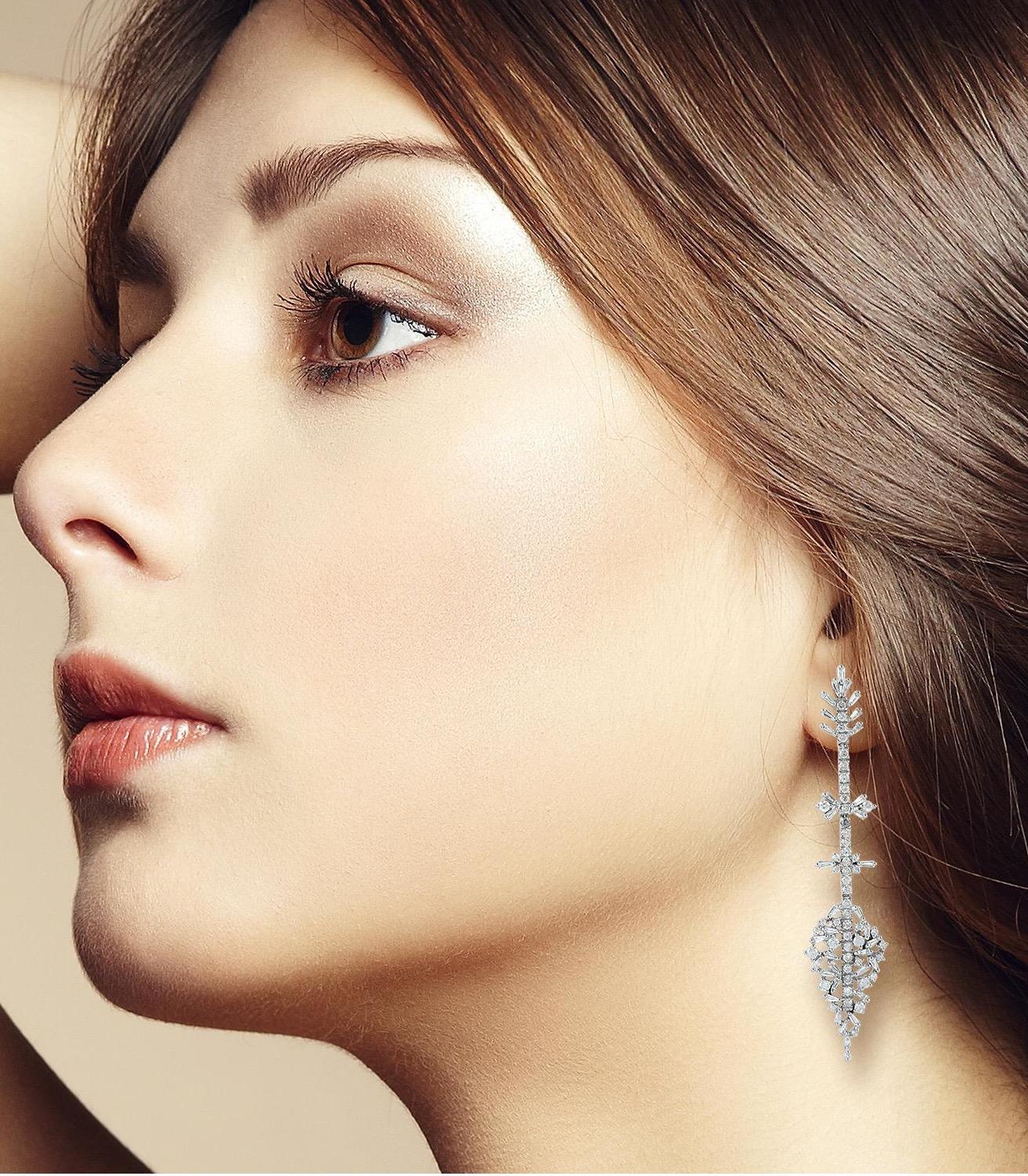 Handcrafted from 18-karat white gold, these stunning arrow drop earrings are set with 4.45 carats of glimmering baguette diamonds. 

FOLLOW  MEGHNA JEWELS storefront to view the latest collection & exclusive pieces.  Meghna Jewels is proudly rated