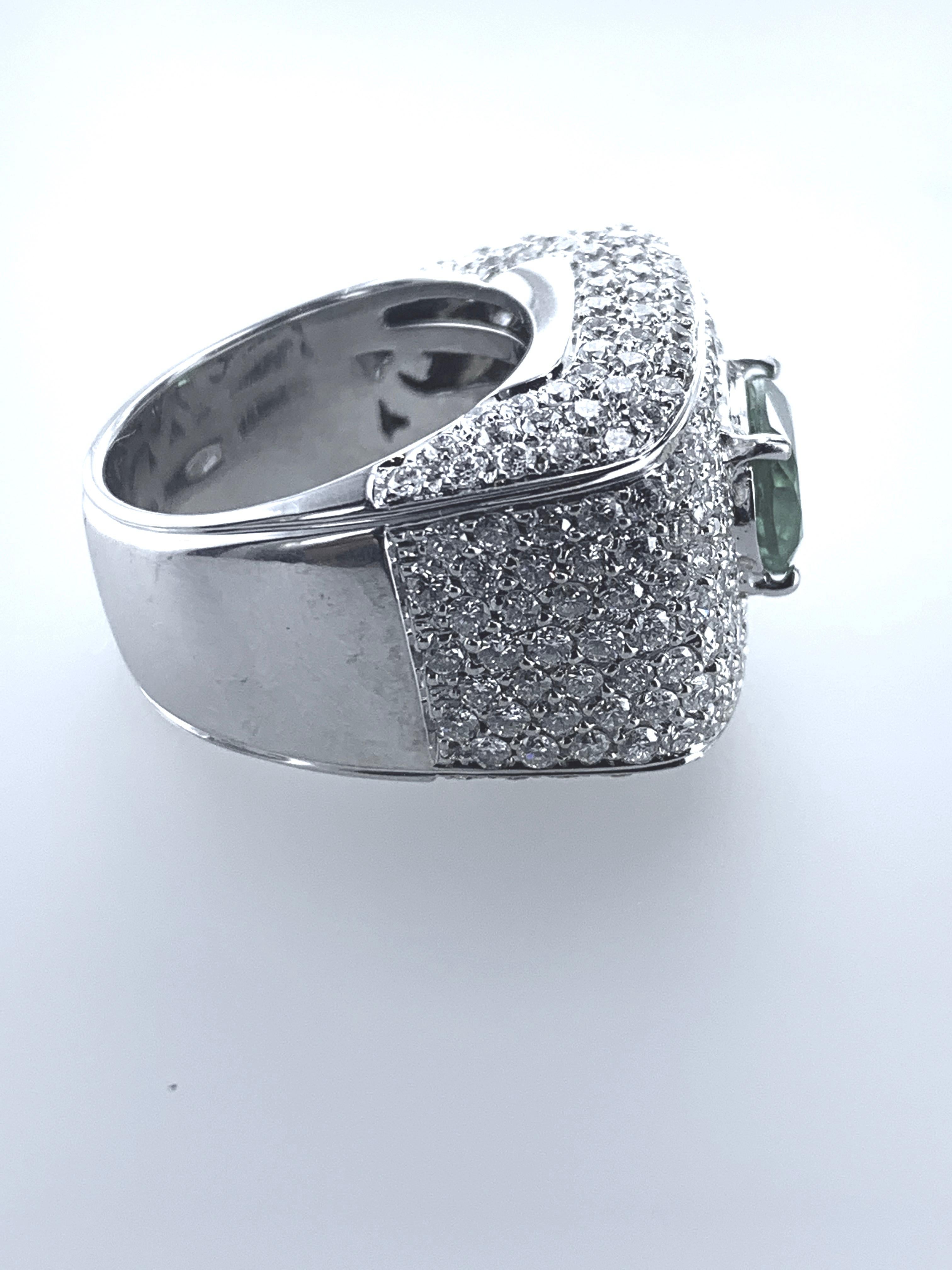 This 4.45 Carat Emerald & Diamond Cocktail Ring is set in 18Kt White Gold. 

Stunningly it empowers the finger with multiple mini Diamonds and its unique rectangular design holding an oval Emerald of 2.09 carats, in the heart of the ring. 

Unique