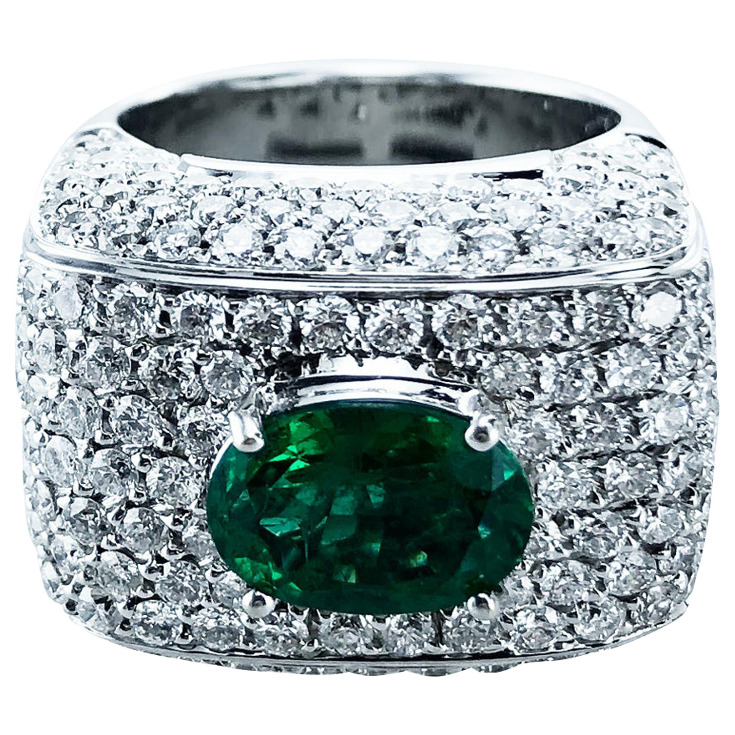 4.45 Carat Oval Emerald & 4.45 Carat Diamond set in 18Kt White Gold Ring