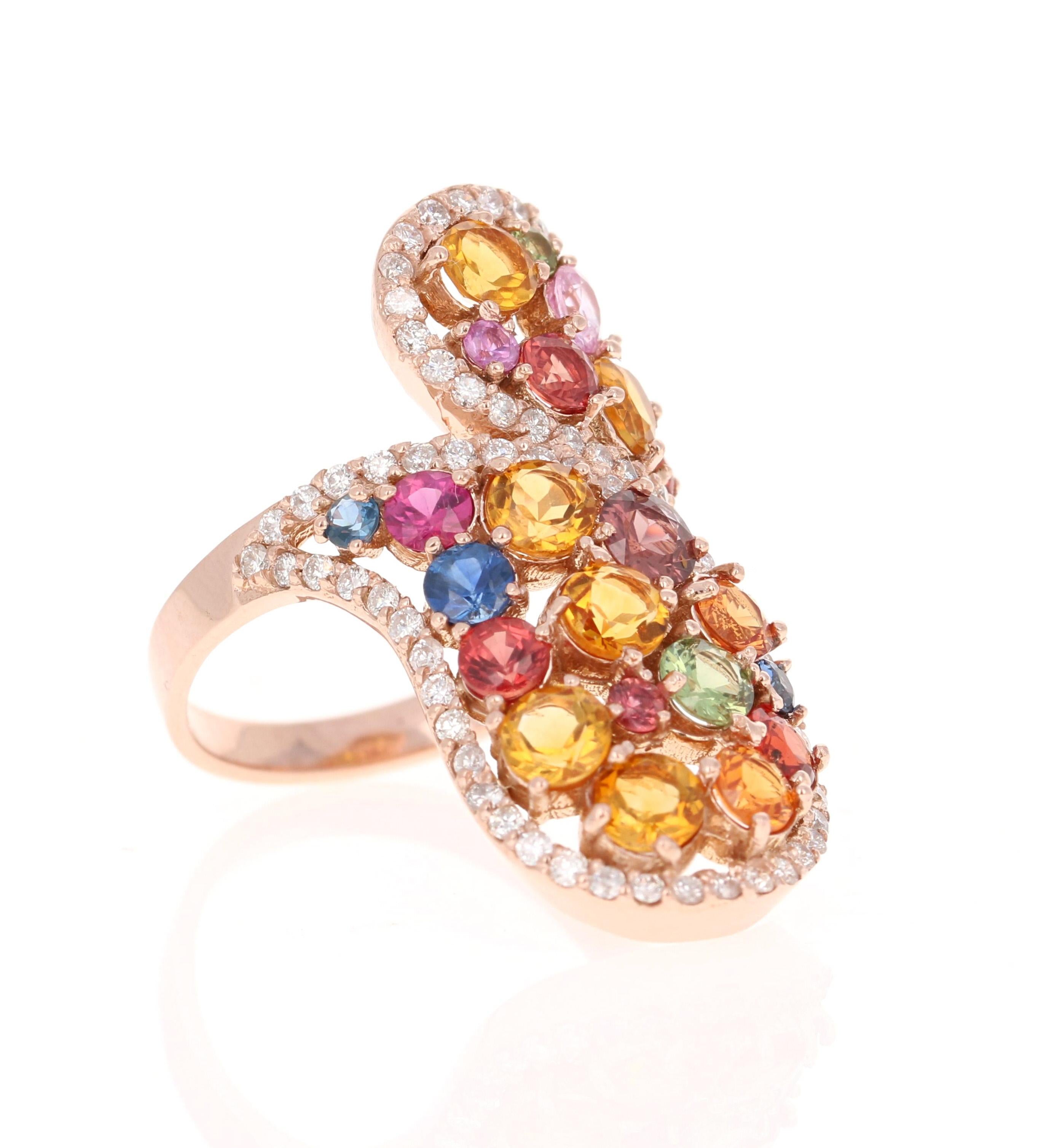 Super gorgeous and uniquely designed 4.45 Carat Multi-Colored Sapphire Topaz and Diamond 14K Yellow Gold Cocktail Ring!

This ring has a cluster of 22 Round Cut Multi-Colored Sapphires and Yellow Topaz that weigh 3.75 carats and 73 Round Cut