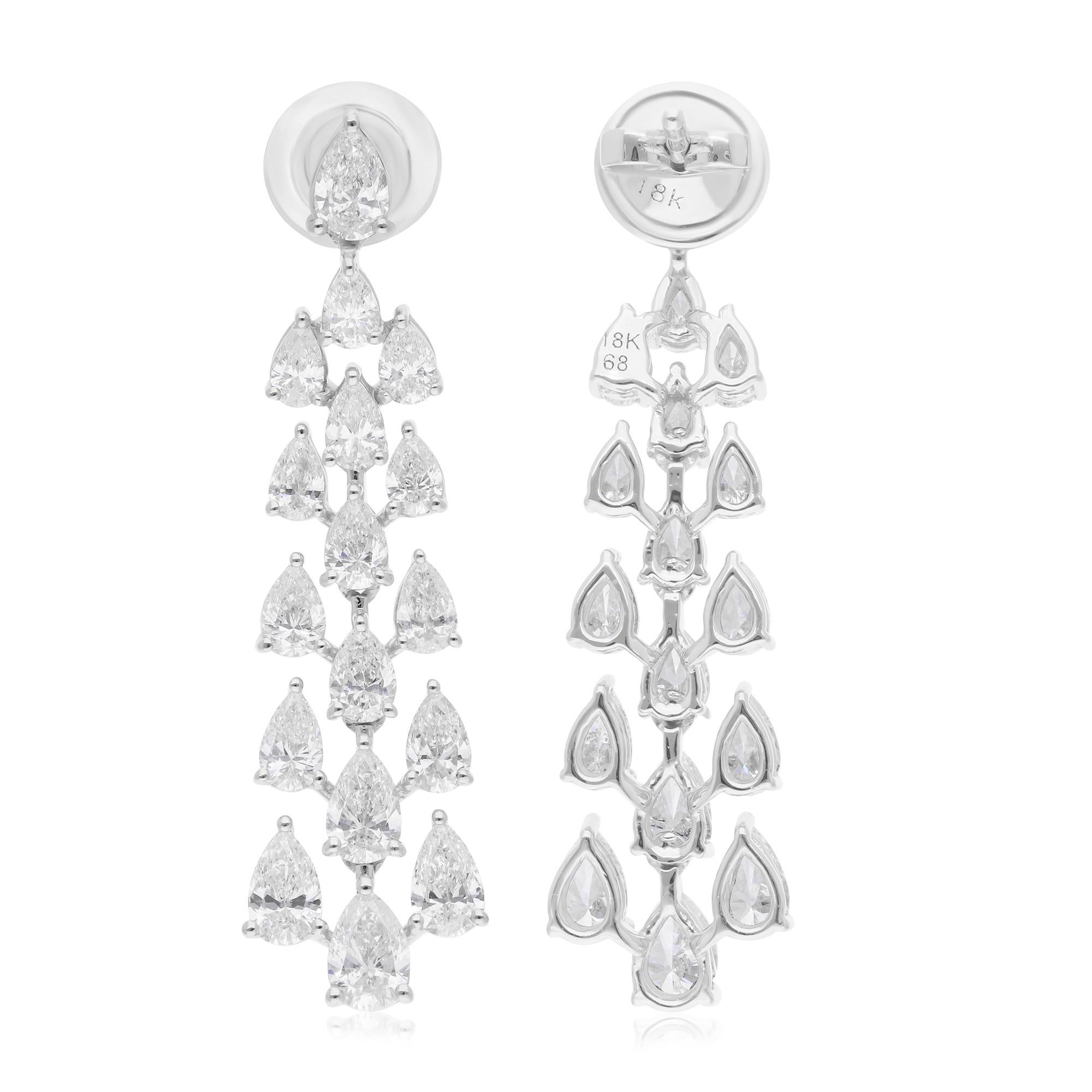 These exquisite dangle earrings feature 4.45 carats of pear brilliant-cut diamonds, elegantly set in 18 karat white gold. The diamonds, with SI1-SI2 clarity and H-I color, radiate exceptional brilliance, creating a captivating sparkle that enhances