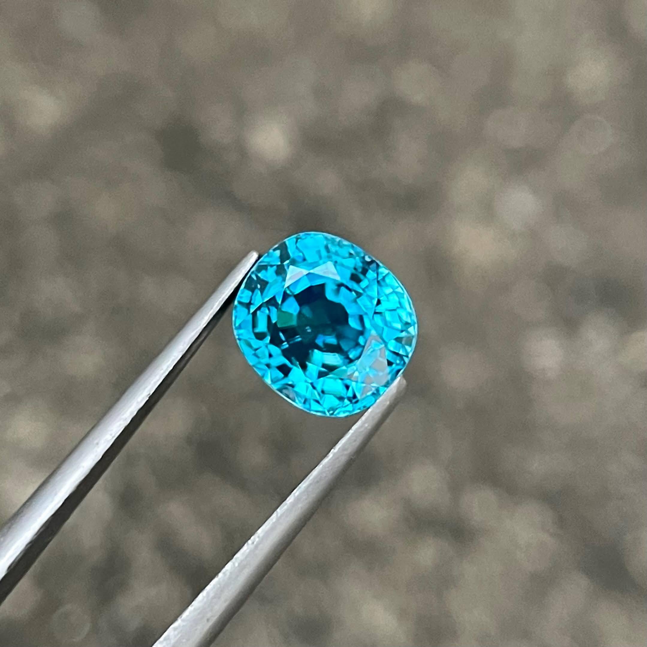 Weight 4.45 carats 
Dimensions 8.75x7.90x6.00 mm
Treatment Heated 
Origin Cambodia 
Clarity VVS
Shape oval 
Cut Faceted 



This exquisite 4.45 carat Blue Zircon gemstone is a stunning example of natural beauty, sourced from the rich lands of