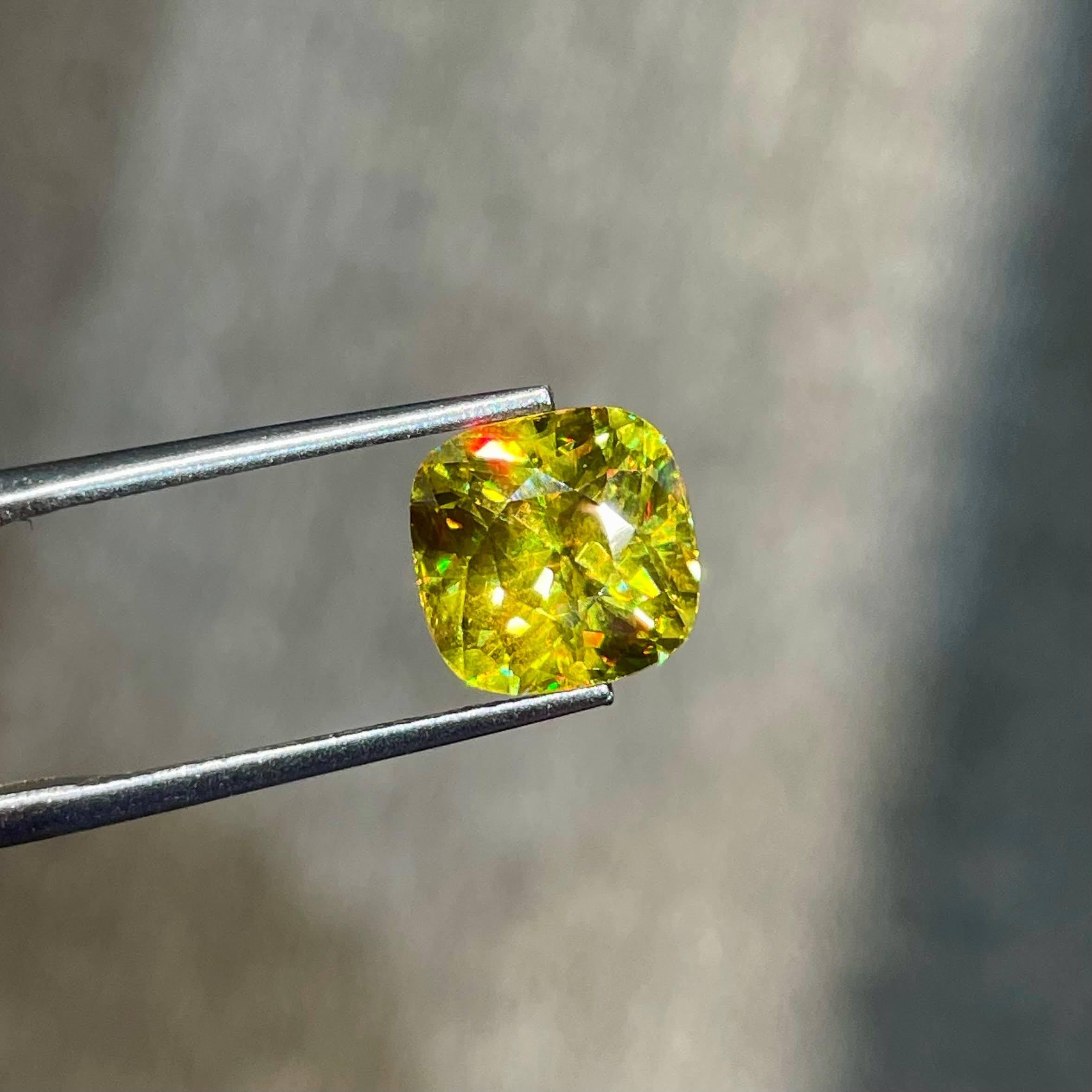 Weight 4.45 carats 
Dimensions 9.1x9.0x6.8 mm
Treatment none 
Origin Madagascar 
Clarity VVS
Shape cushion 
Cut fancy cushion




In the realm of exquisite gemstones, a dazzling 4.45 carat Sphene takes center stage, showcasing the epitome of top