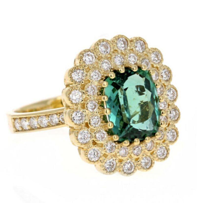 4.45 Carats Natural Very Nice Looking Green Tourmaline and Diamond 14K Solid Yellow Gold Ring

Total Natural Cushion Tourmaline Weight is: Approx. 3.50 Carats (Treatment-Heat)

Tourmaline Measures: Approx. 10.00 x 8.00mm

Natural Round Diamonds