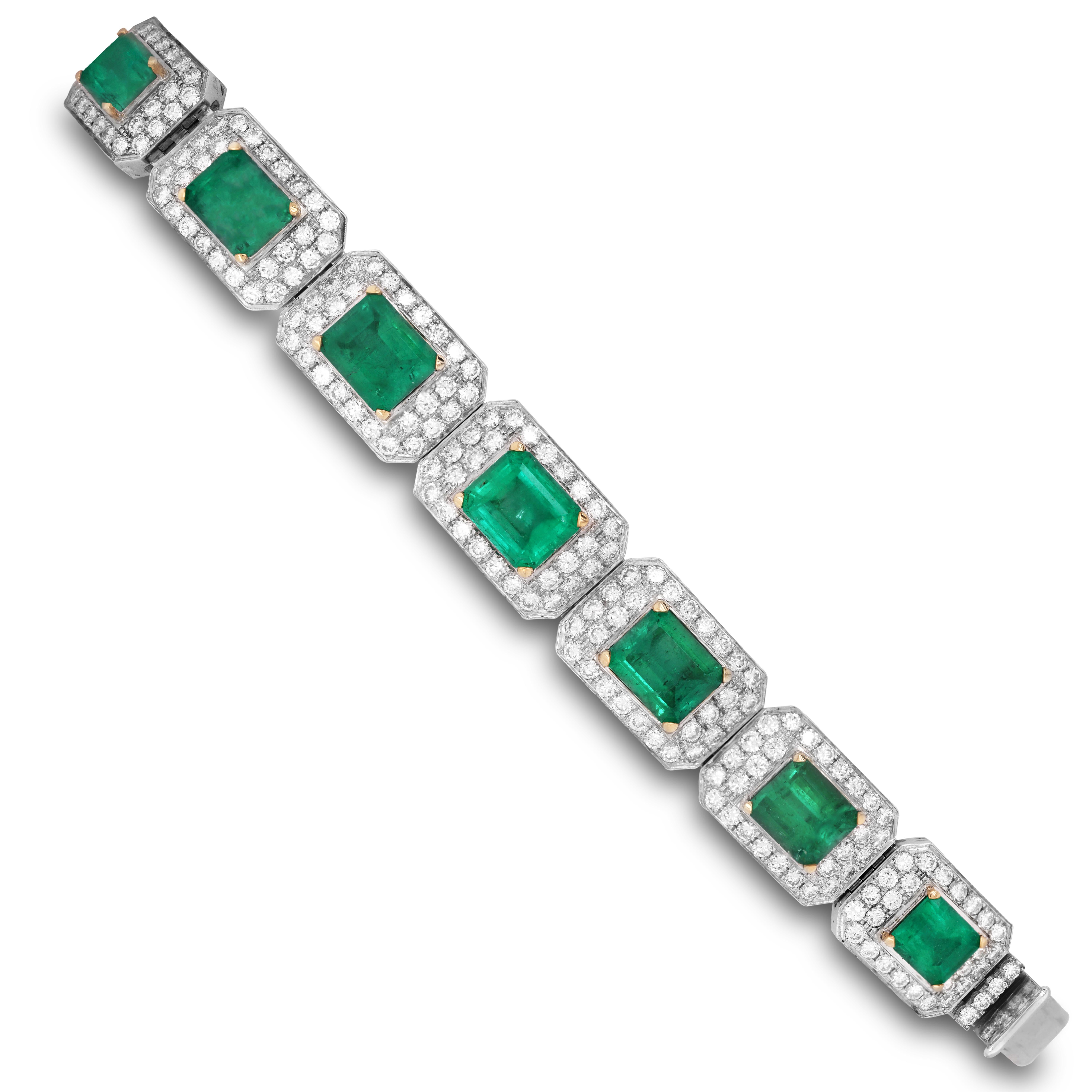 44.50 Carat Emerald Diamond 18K White Yellow Gold Wide Bracelet

Apprx. 44.50 carat Emeralds total weight. (Origin is unknown, but we suspect Zambian from the color).

16.50 carat G color, VS clarity white diamonds total weight.

Bracelet is 7