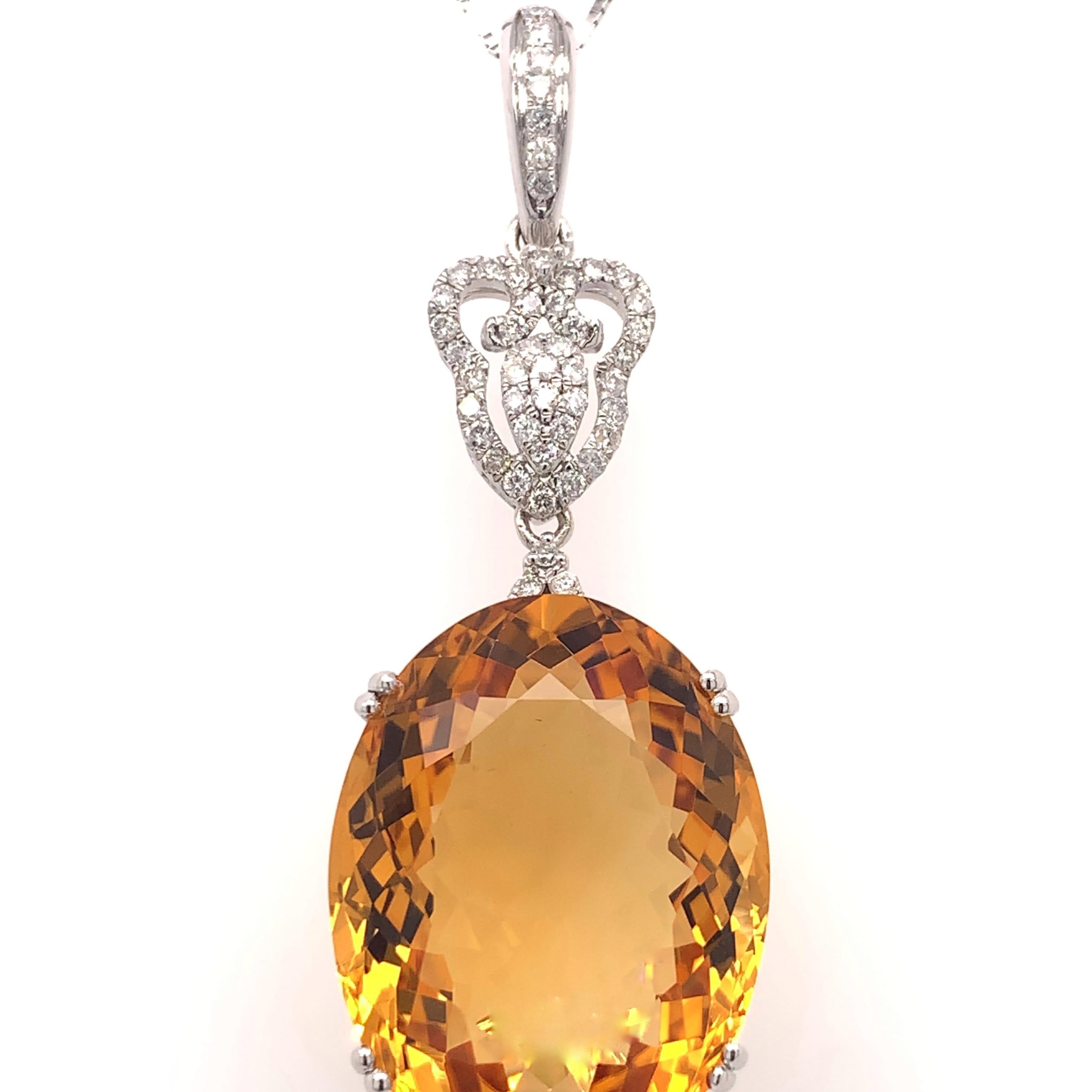 Stunning citrine pendant earrings set. High brilliance, oval faceted, golden honey tone total 44.57 carats natural citrine, mounted on the open basket with eight bead prongs, accented with a round brilliant cut diamond. Handcrafted contemporary