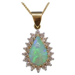 4.45ct Pear Shape Opal
Diamond Cluster Pendant 18 Karat Yellow and White Gold 4.45ct Pear Shape Opal
Diamond Cluster Pendant 18 Karat Yellow and White Gold