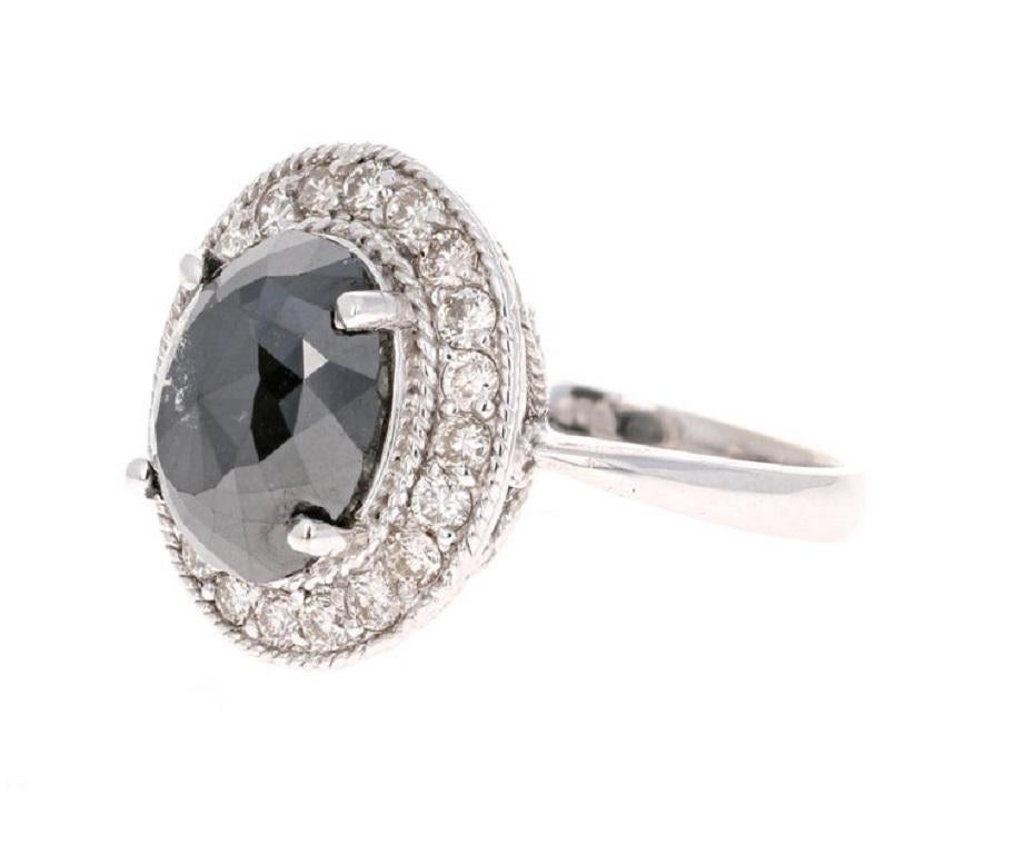 Gorgeous on-trend 3.85 Carat Oval Cut Black Diamond ring surrounded by 20 Round Brilliant Cut Diamonds that weigh 0.61 carats.  The total carat weight of the ring is 4.46 carats.

The Black Diamond are natural diamonds that have been color-treated