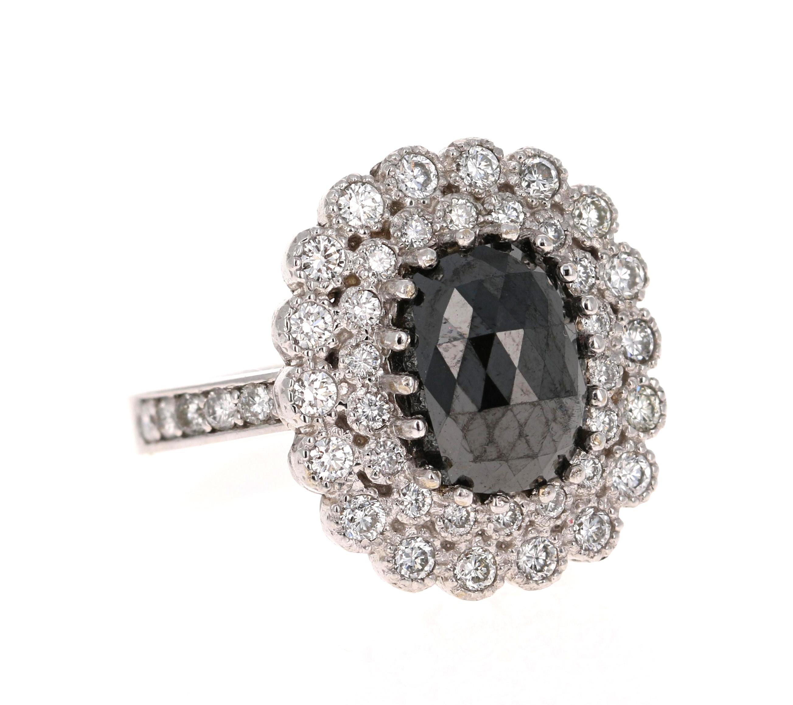 Gorgeous Black Diamond ring that can transform into an Engagement ring.  

There is a 3.34 Carat Oval Cut Black Diamond in the center on the ring which is surrounded by a bright and sparkling cluster of 48 White Round Cut Diamonds that weigh 1.12