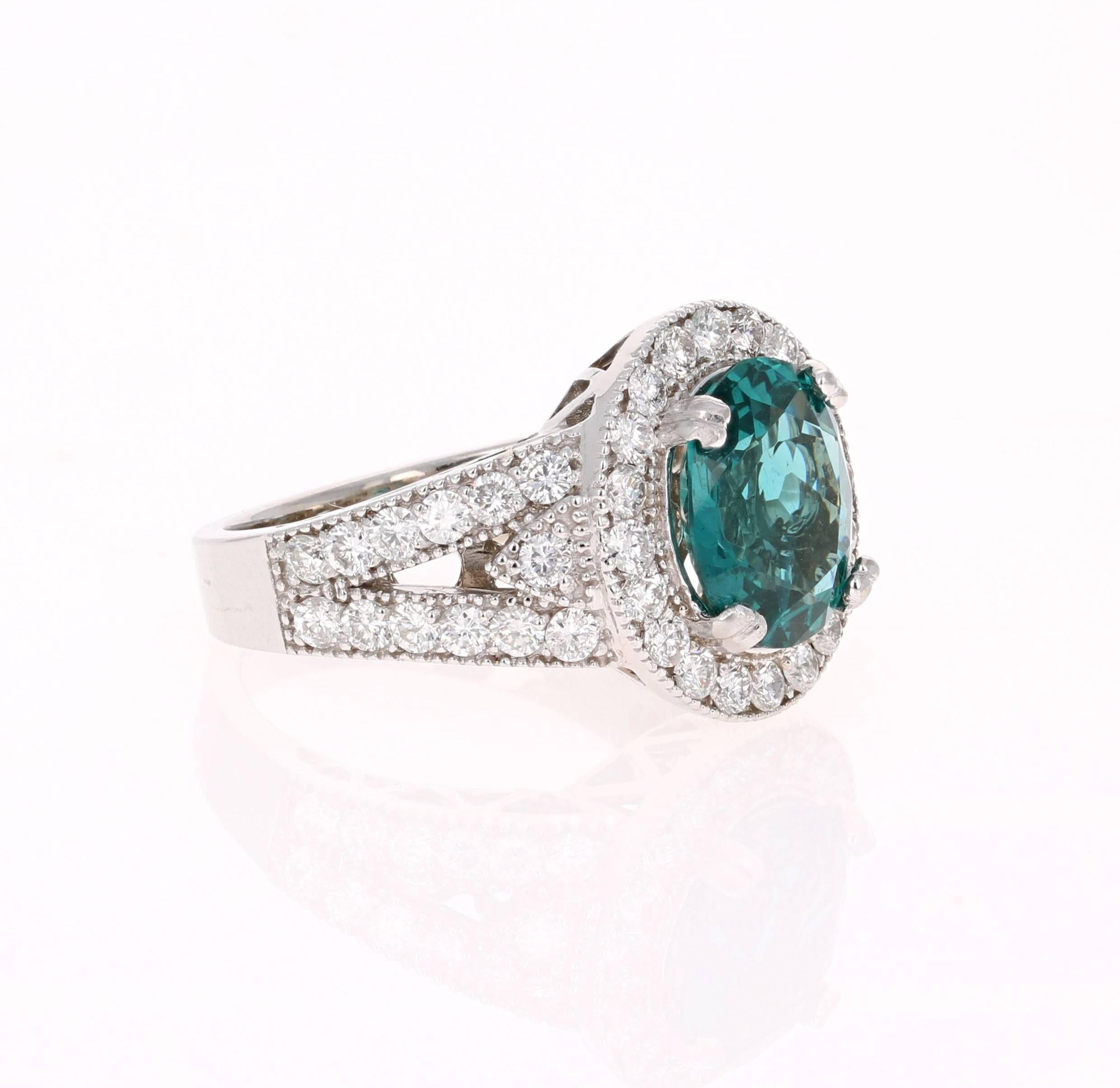 Stunning 4.47 Carat Apatite Diamond White Gold Cocktail Ring that is sure to elevate your accessory collection!

The ring has a 3.05 Carat Oval Cut Apatite set in the center of the ring surrounded by 48 Round Cut Diamonds that weigh 1.42 carats. The
