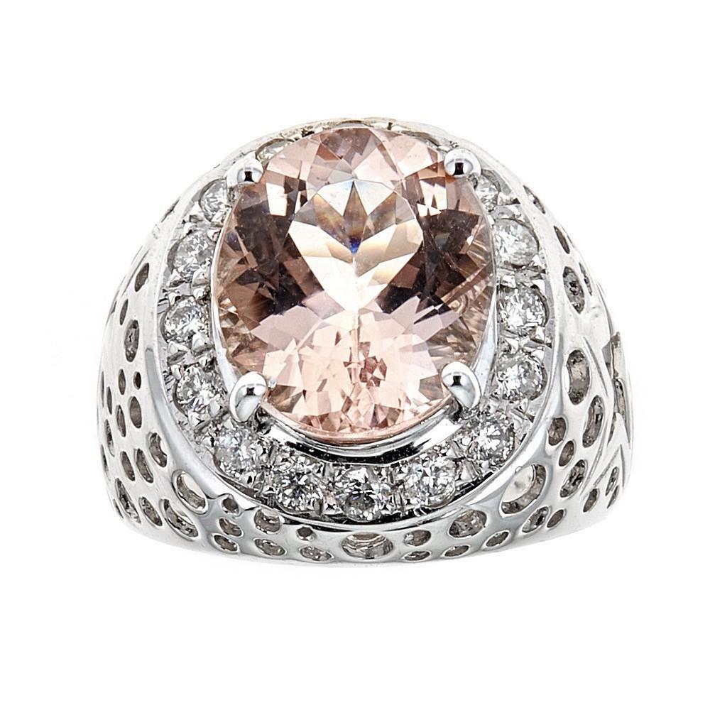 4.47 Carat Morganite and 0.70 Carat Diamond Solitaire Ring 14 Karat White Gold

Crafted in 14k White Gold, this Unique design showcases Pale pink 4.47 TCW oval-shaped Morganite, set in a halo of round mesmerizing diamonds, totaling 0.70 TCW. 