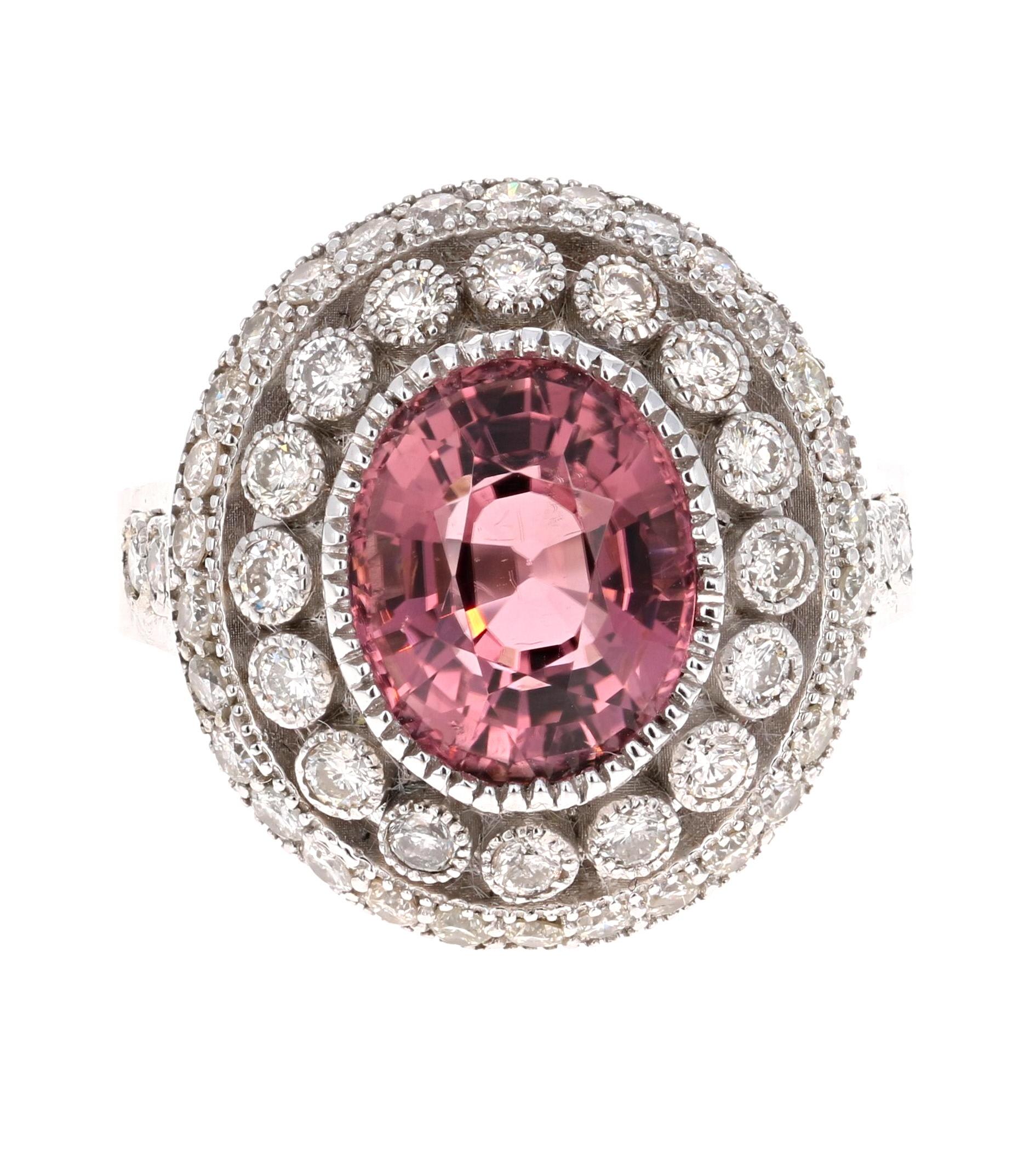 This ring has a beautiful setting that will look gorgeous on any hand that loves to wear antique/vintage style jewelry. It has a Oval Cut Pink Tourmaline weighing 3.41 Carats. There are 52 Round Cut Diamonds beautifully set that weigh 1.06 Carats.