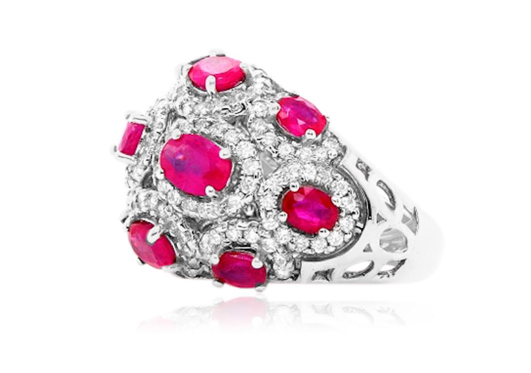 Material: 14k White Gold
Gemstones: 13 Oval Rubies totaling 4.47 Carats,
Diamonds: Brilliant Round White Diamonds at 1.50 Carats. SI Clarity / H-I Color. 
Ring Size: 6. Alberto offers complimentary sizing on all rings.

Fine one-of-a-kind