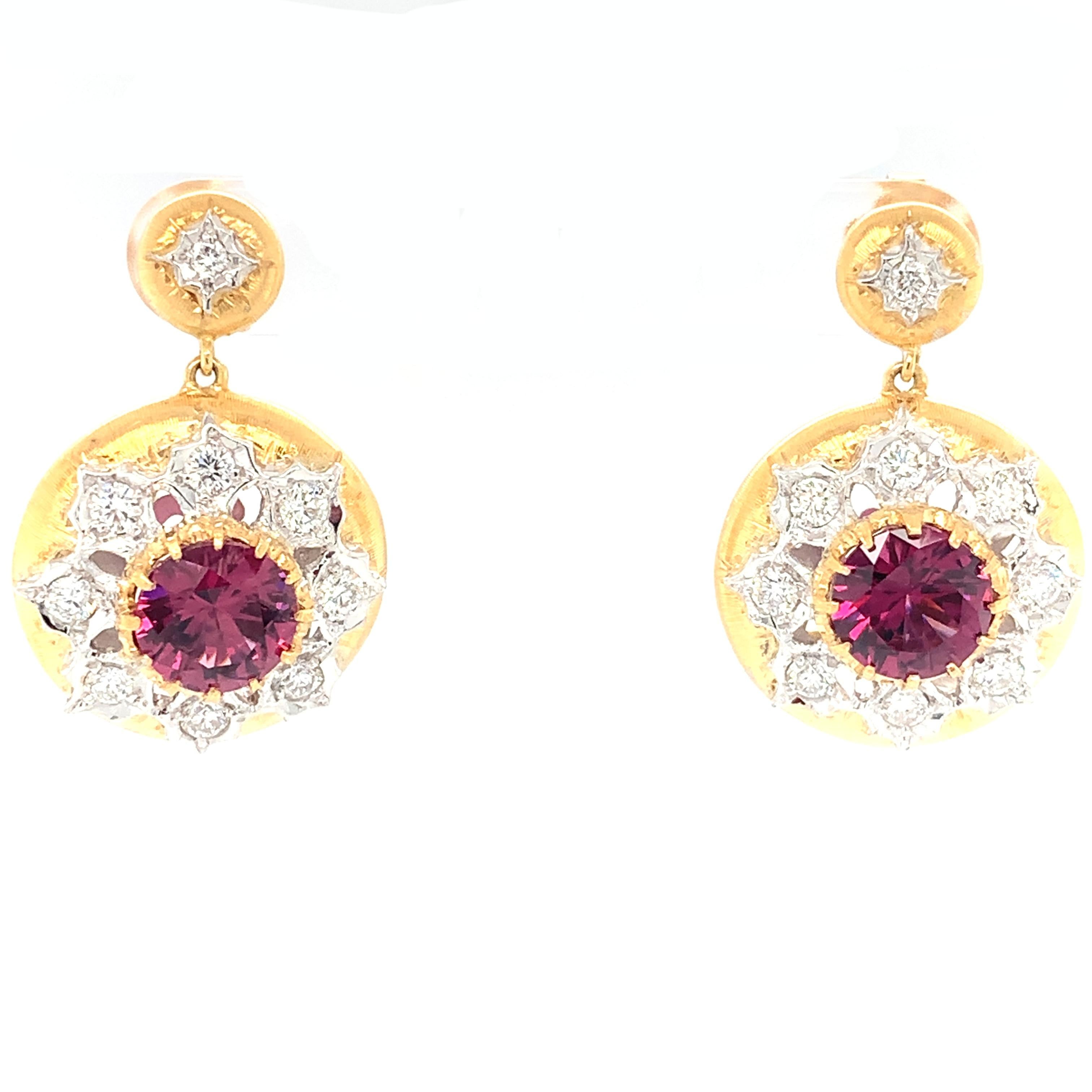 Handmade in Italy in the Florentine style, these stunning 18k yellow and white gold earrings feature world-class gemstones and craftsmanship. Garnets have long been a favorite of gem connoisseurs, and a pair perfectly matched, richly colored deep