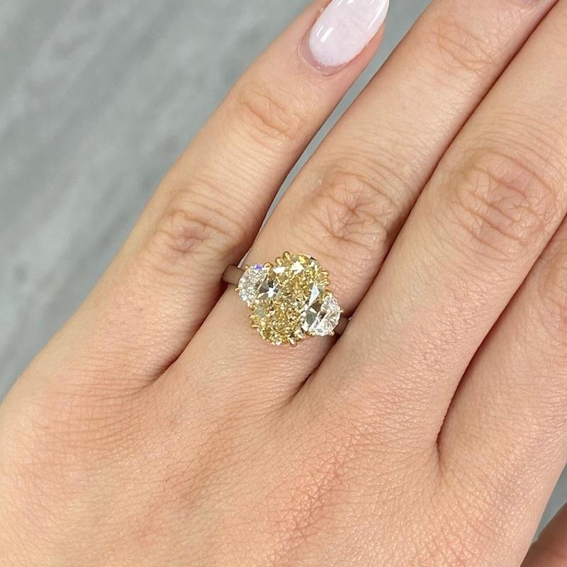 4.47ct GIA IF Fancy Brownish Yellow Oval Diamond Three Stone Ring In New Condition For Sale In New York, NY