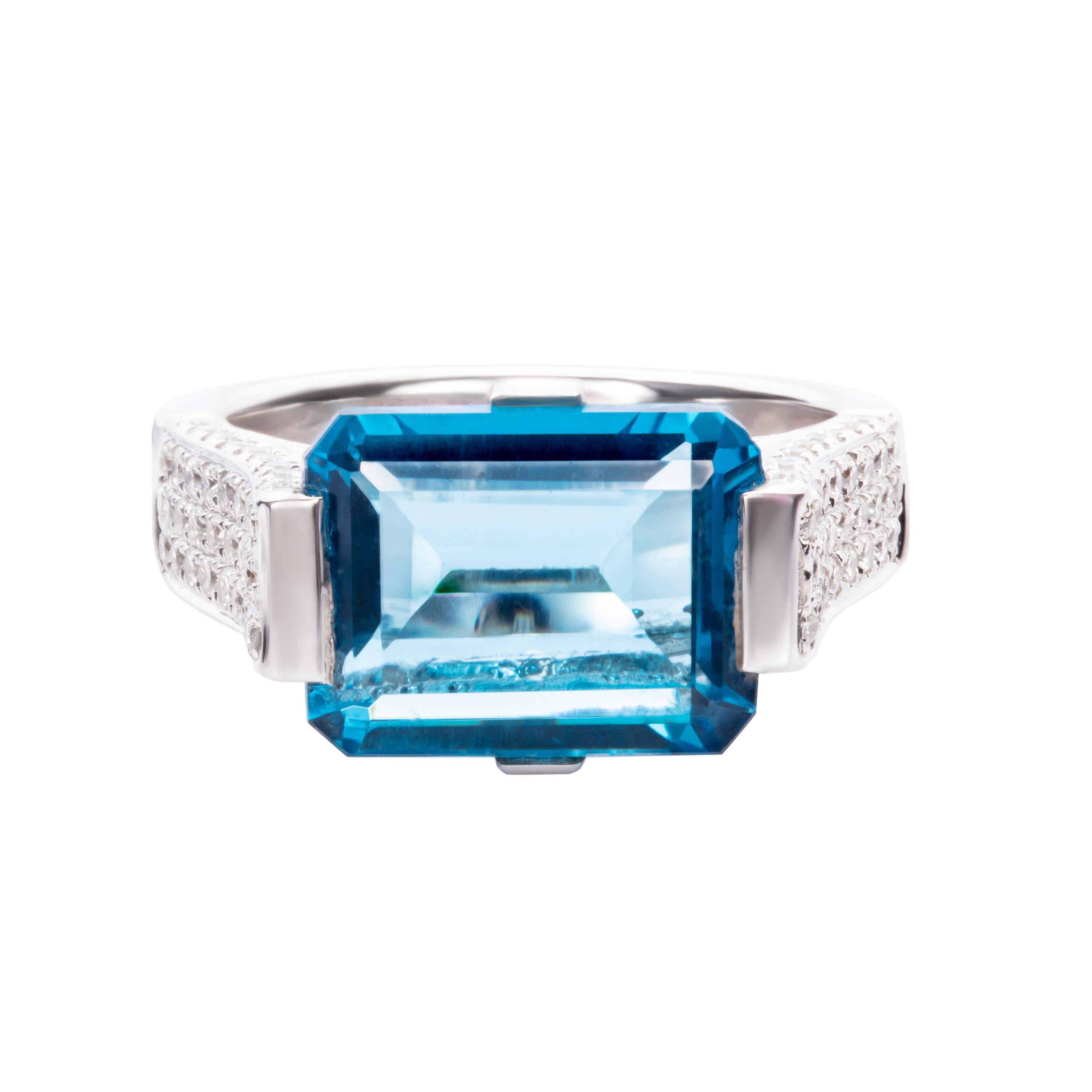 Rendered in lustrous 18-karat white gold, Butani's ring is centered with an unmissable 4.48 carat blue topaz surrounded by 0.98 carats of sparkling white diamonds.  Gift yours to a friend or loved one.  Currently a ring size US 7.  For other sizes,