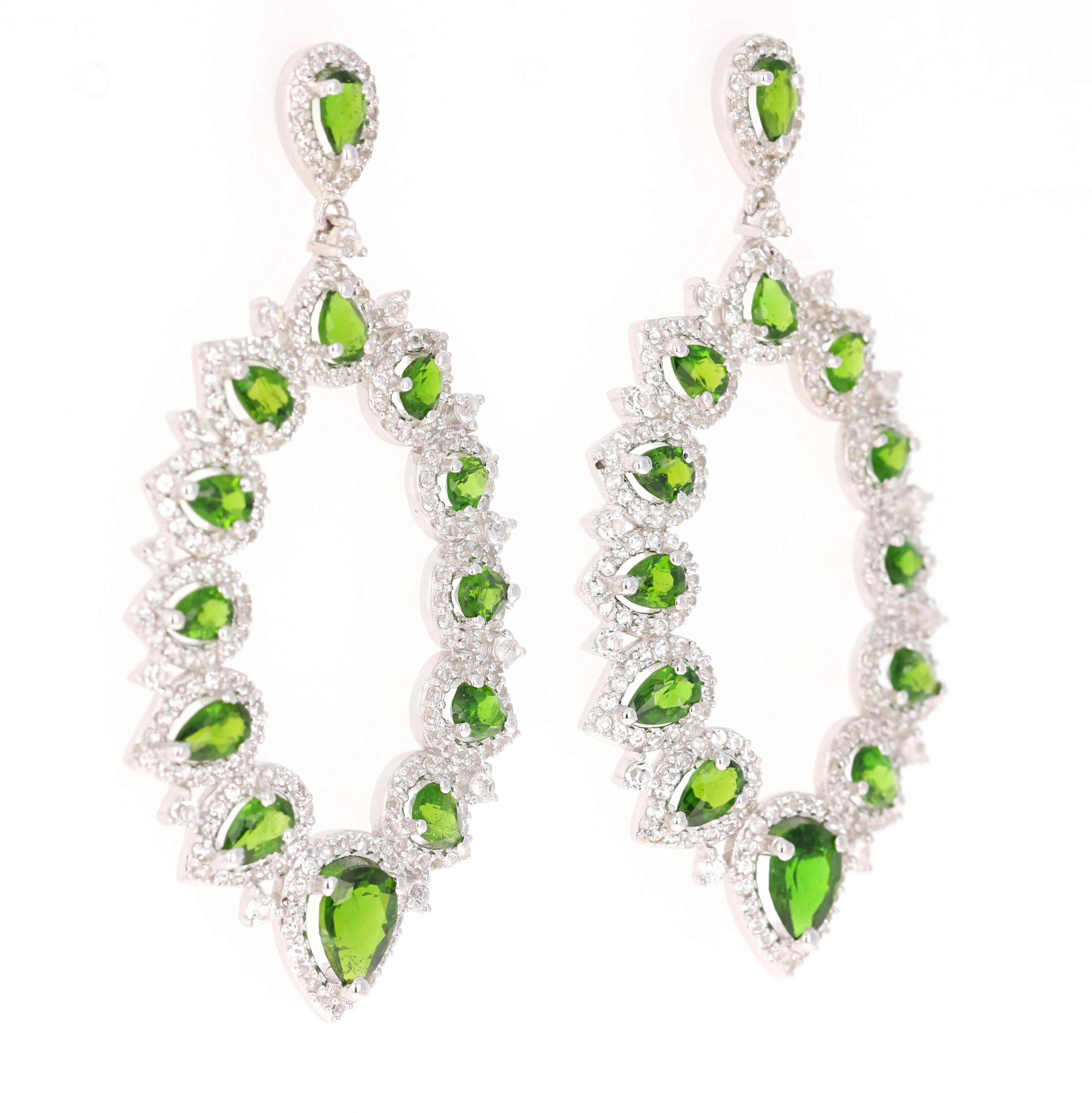 Stunning Chandelier Dangle Earrings 

These earrings have 4.48 Carats of Chrome Diopside and White Topaz

They are beautifully curated in 925 Silver weighing approximately 13.0 grams 

They are 2 inches long. 
