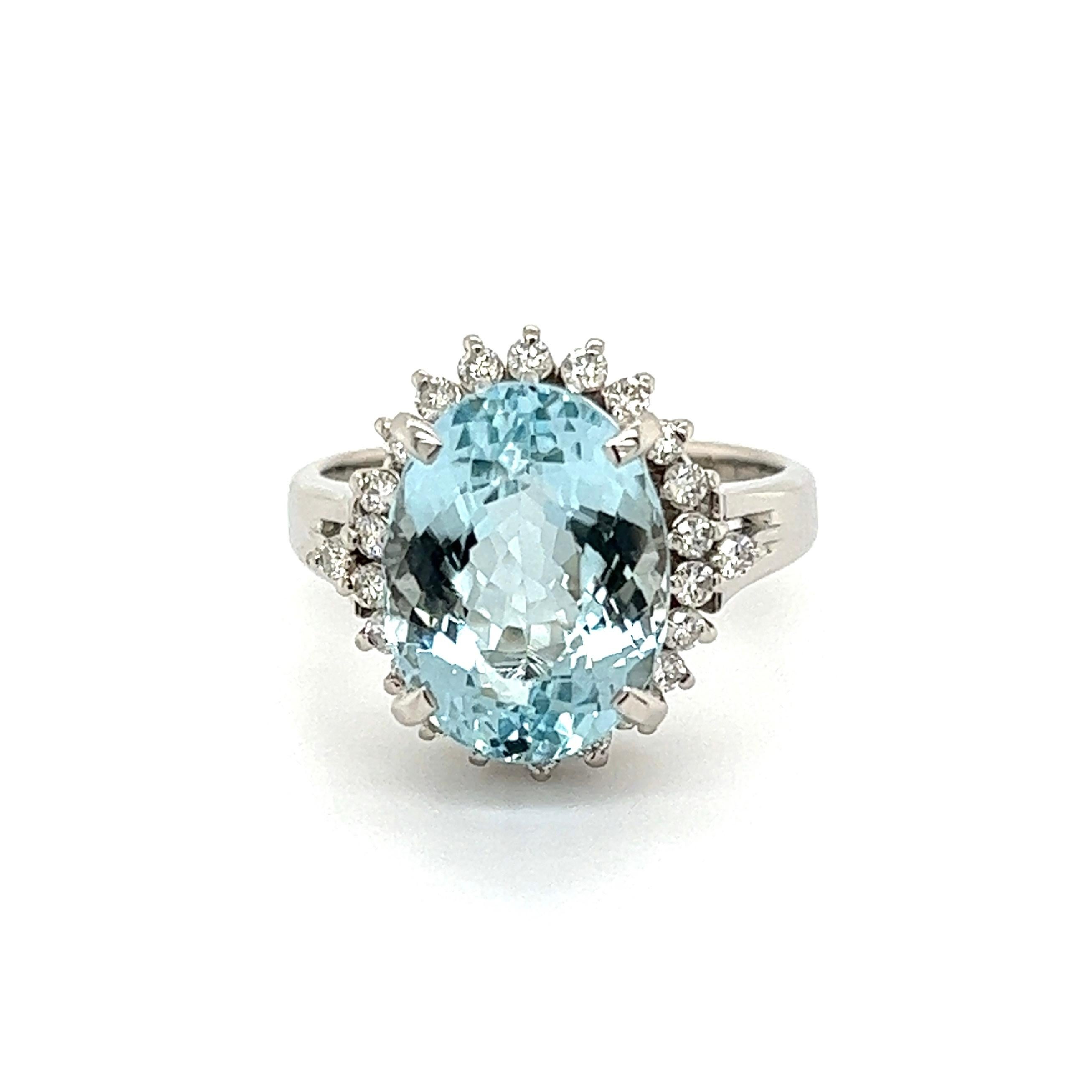 Simply Beautiful! Finely detailed Aquamarine and Diamond Platinum Halo Ring. Centering a securely nestled Oval Aquamarine, weighing approx. 4.48 Carats surrounded by Diamonds, approx. 0.29tcw. Approx. dimensions: 1.02” l x 0.74” w x 0.60” h. Hand