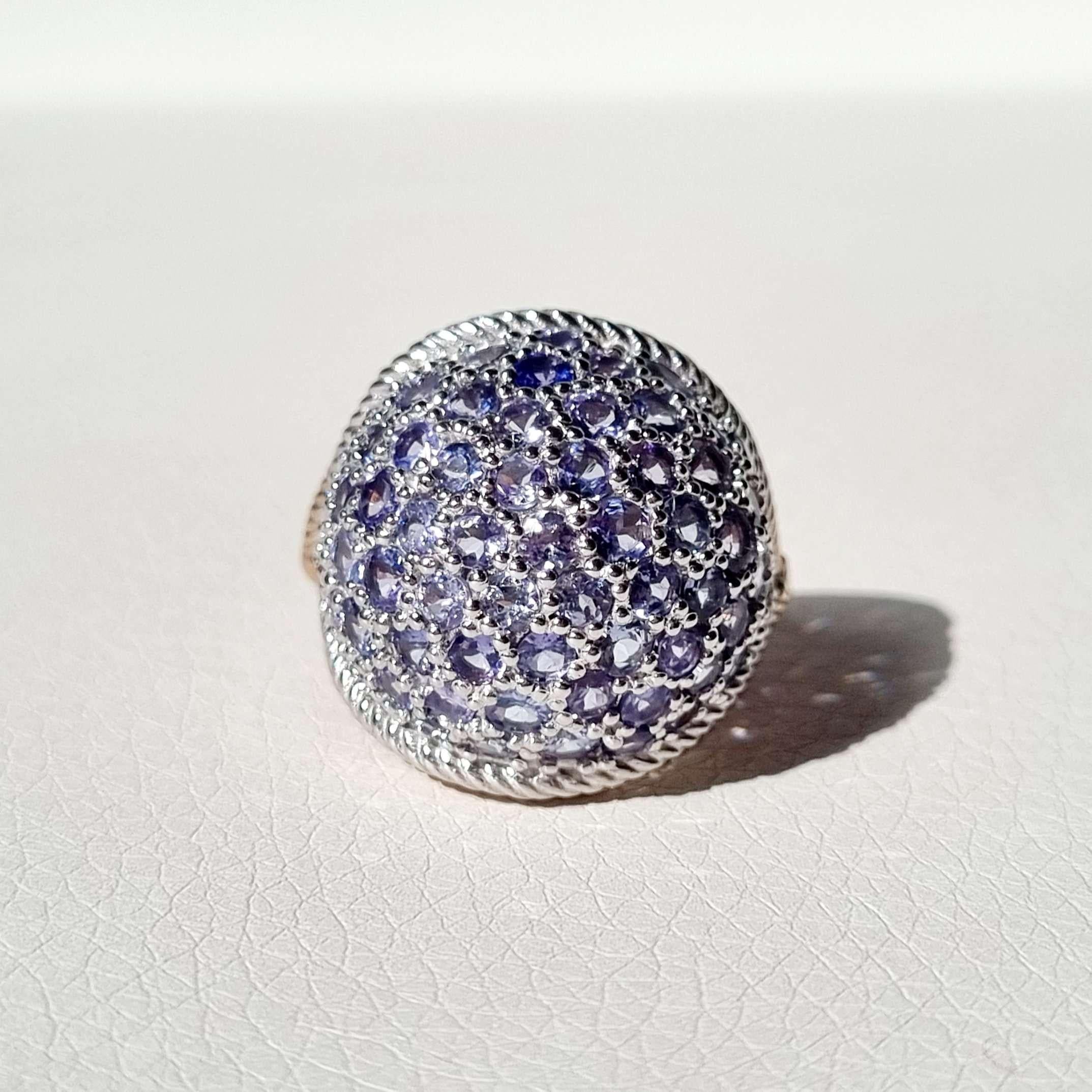 A gorgeous dome statement ring made of 448 ct natural tanzanite. This piece is a show-stopper and a topic it self.

Total weight: 11.8 gr
Material: 14k solid white and rose gold, can also be ordered in yellow, white and rose (made to order)

Main