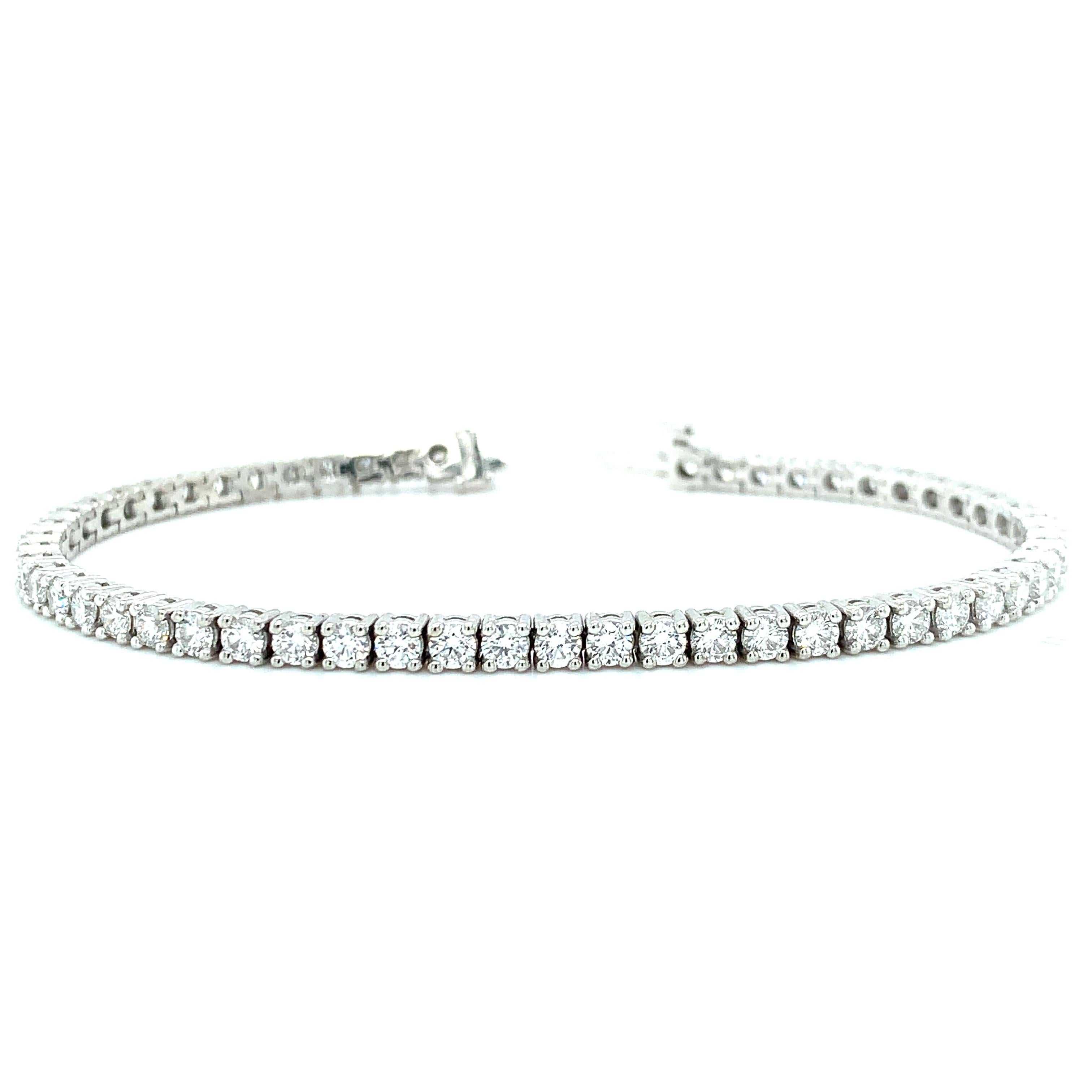 This stunning tennis bracelet is set with nearly four and half carats of gorgeous, sparkling diamonds! Set in all platinum, each of the diamonds has been hand-selected and matched for size and quality. Each stone is extremely well-cut for maximum
