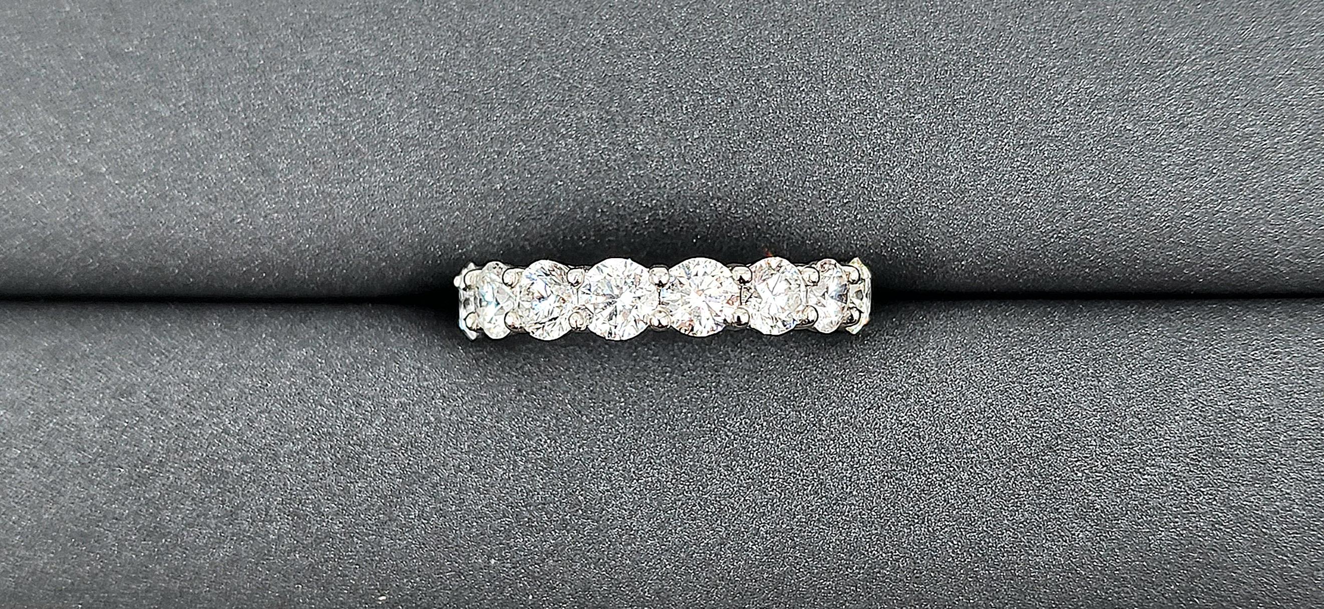 This gorgeous diamond eternity band features 16 round brilliant diamonds set in platinum. The diamonds boast a color of G/H and SI1/SI2 in clarity. A beautiful ring to add to any wardrobe!
