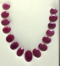 448.41 Carats Ruby Mozambique Oval Faceted Cut stone Layout Heated Natural Gem