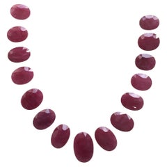 448.41 Carats Ruby Mozambique Oval Faceted Cut stone Layout Heated Natural Gem