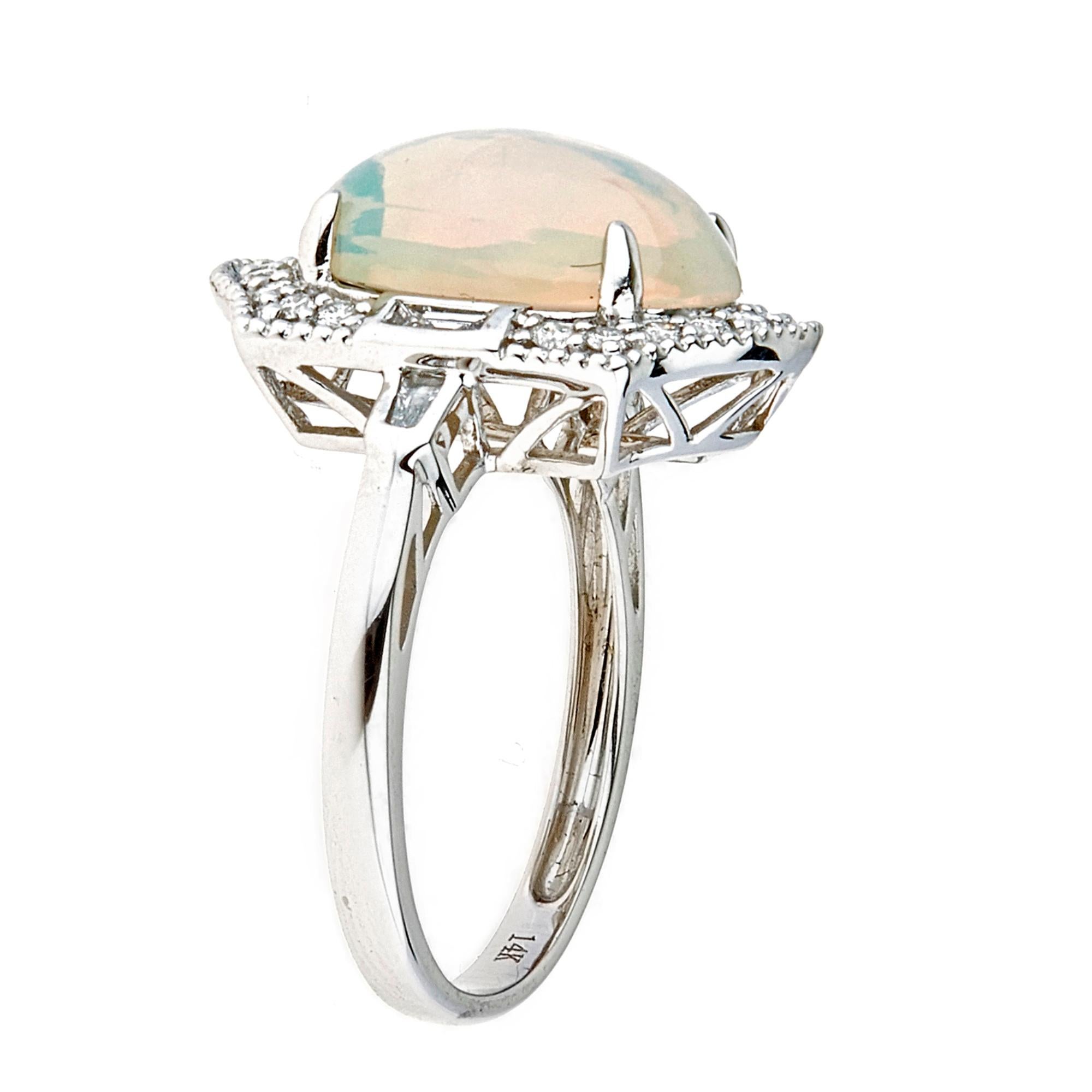Decorate yourself in elegance with this Ring is crafted from 14-karat White Gold by Gin & Grace. This Ring is made up of 10x14 mm Oval-Cab (1 pcs) 4.49 carat Ethiopian Opal and Round-cut White Diamond (20 Pcs) 0.26 Carat, Baguette-cut White Diamond