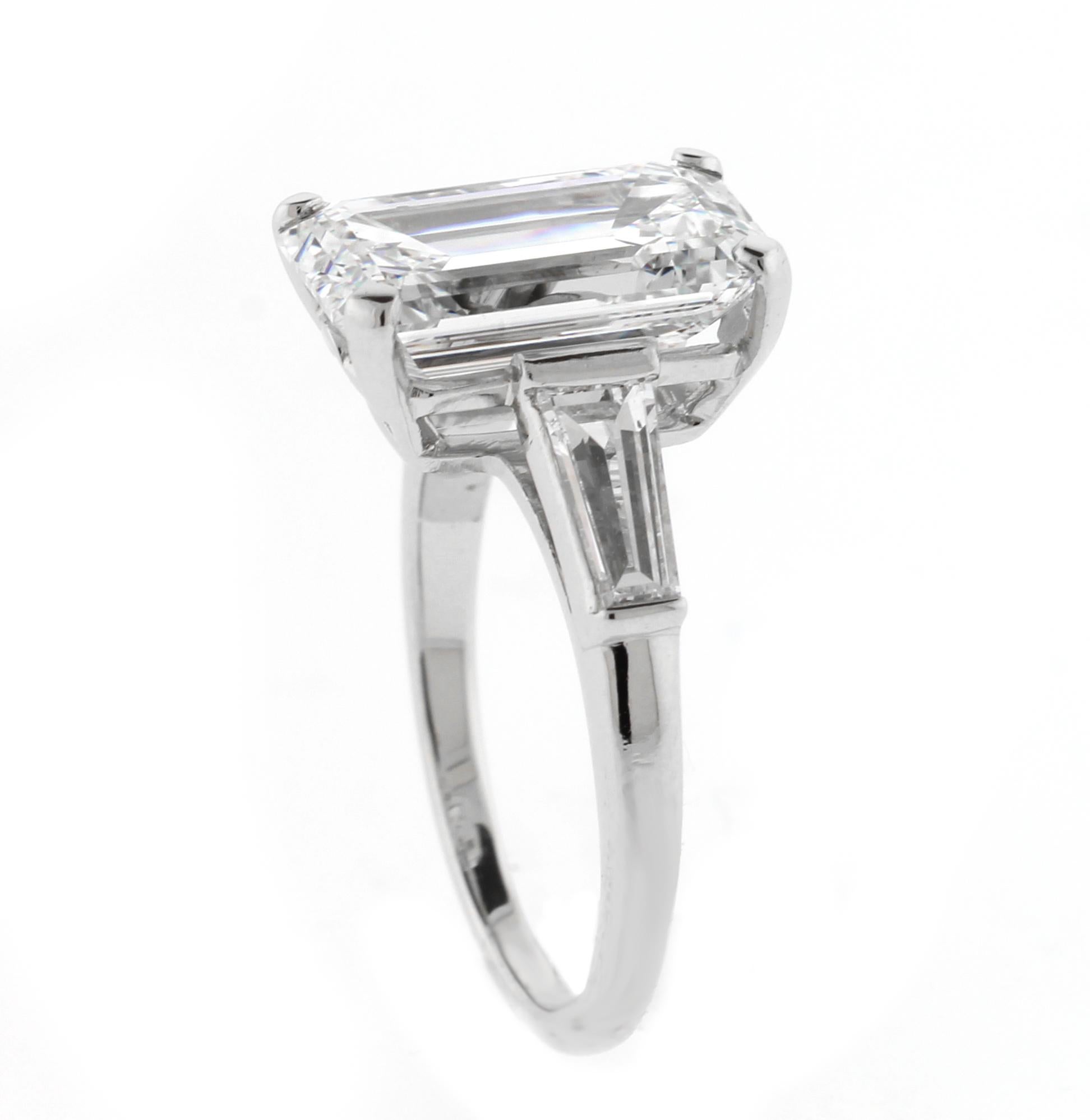From the master ring makers of Pampillonia Jewelers a 4.39 emerald cut diamond platinum ring. The diamond is H color and VS1 clarity. The shape of the diamond is exceptional with well defined corners and distinct architecture. The two tapered