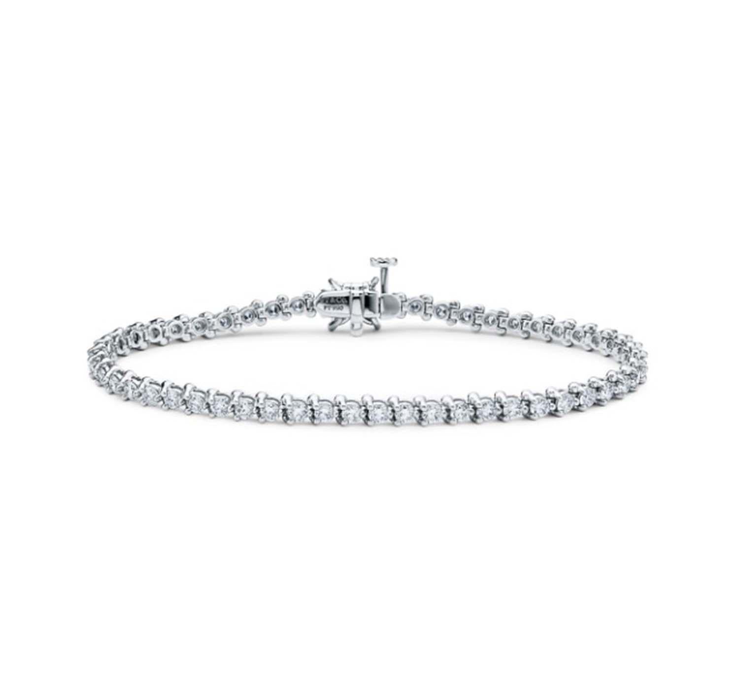 Brand: Tiffany & Co.

Model Name: Victoria 

Metal: Platinum

Metal Purity: 950

Stone: 55 Round Brilliant Cut Diamond 

Necklace Length: 7 inches

Total Carat Weight:  4.49 ct 

Total Item Weight (Grams):  12.6 g 

Hallmarks: T & Co. ;