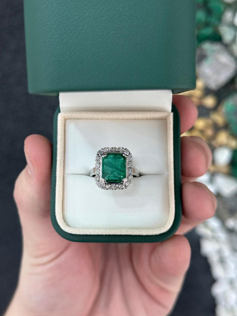 Contemporary 4.49tcw 14K Dark Green Emerald Cut Emerald & Diamond Halo Ring For Sale