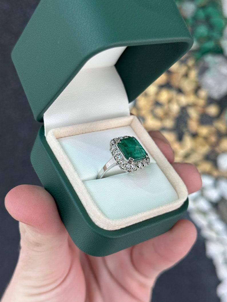 4.49tcw 14K Dark Green Emerald Cut Emerald & Diamond Halo Ring In New Condition For Sale In Jupiter, FL